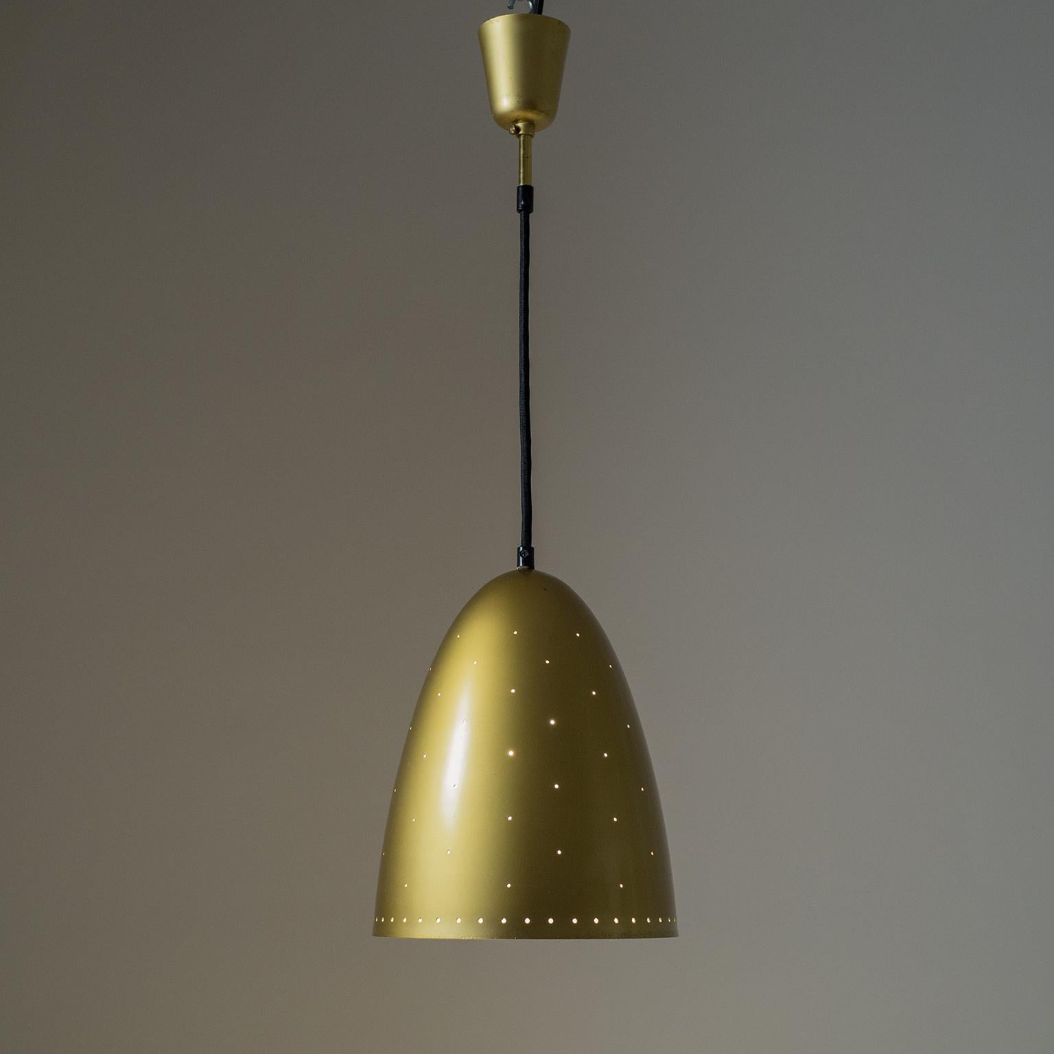 Fine pierced church dome pendant from the 1950s. The large shade and canopy are made of aluminum lacquered in a slightly metallic gold. Good original condition with some patina on the paint. One original brass E27 socket with new textile wiring.