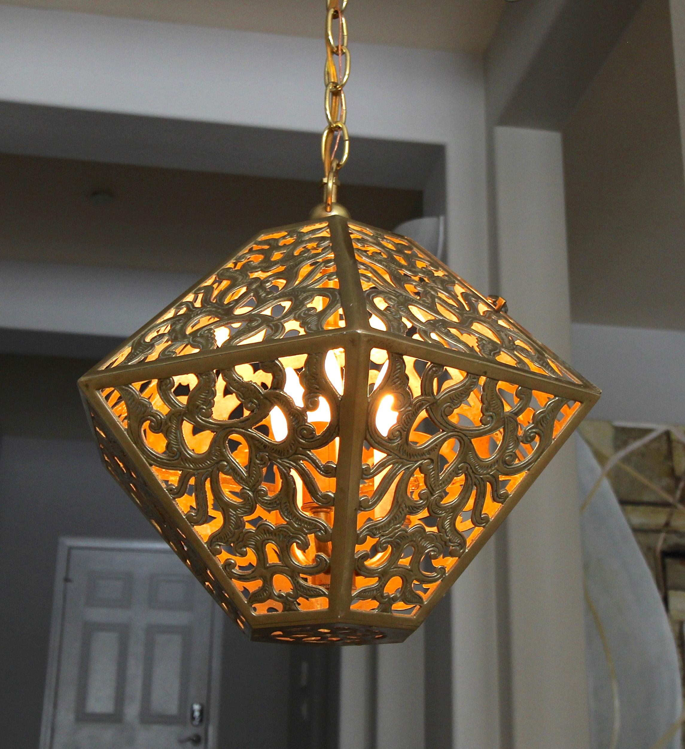 Brass diamond shape (12 sided) Asian ceiling or pendant light with scrolling arabesque patterns. Handcrafted from solid brass in Japan in the 1950s, this pendant has been refitted with a custom brass triple light cluster for a more contemporary