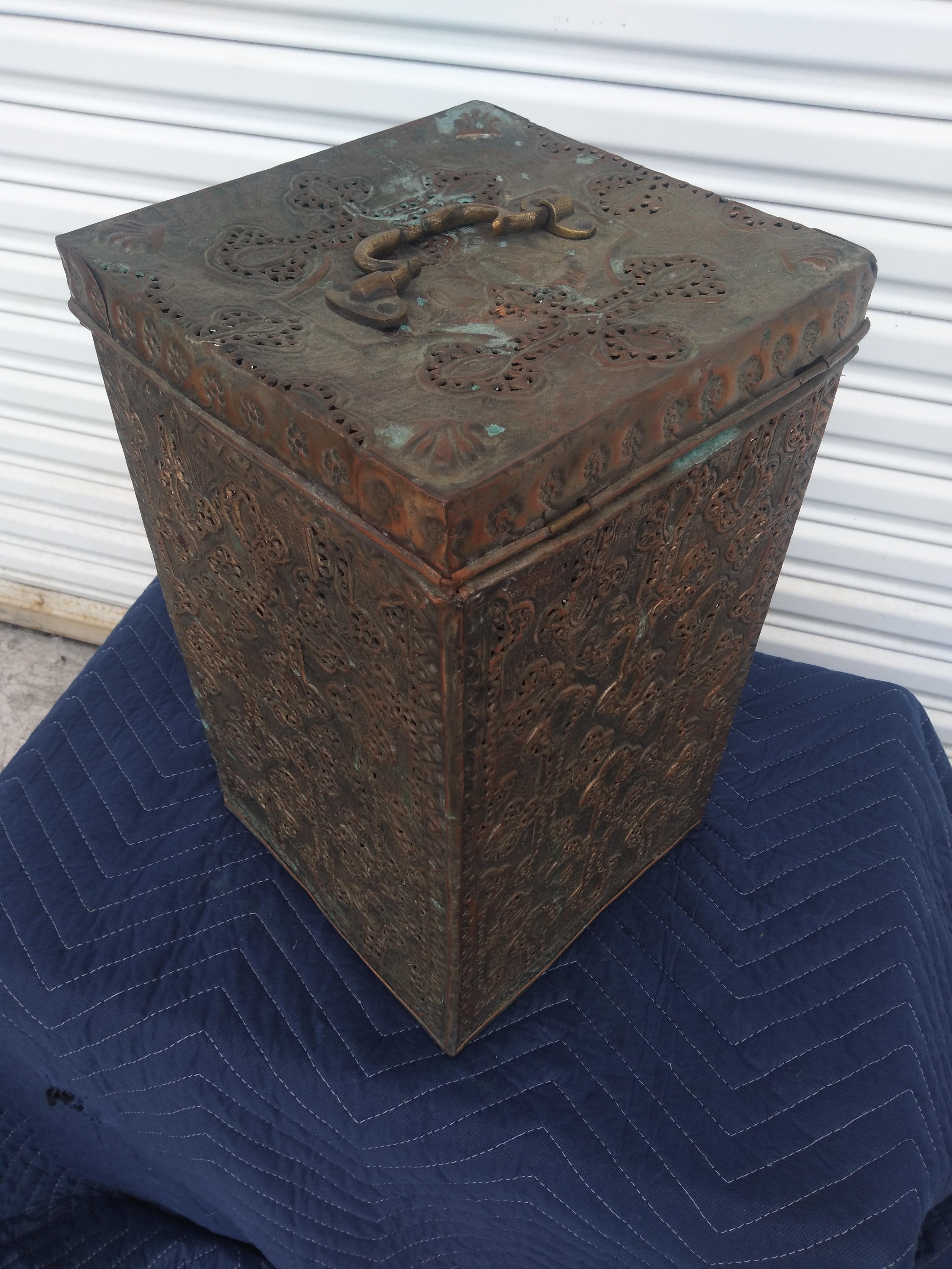This is a copper tinned chest from the Middle East. It has a heavy metal handle and is pierced. The detailing is quite nice as well as the aged patina.

A very nice decorative item.