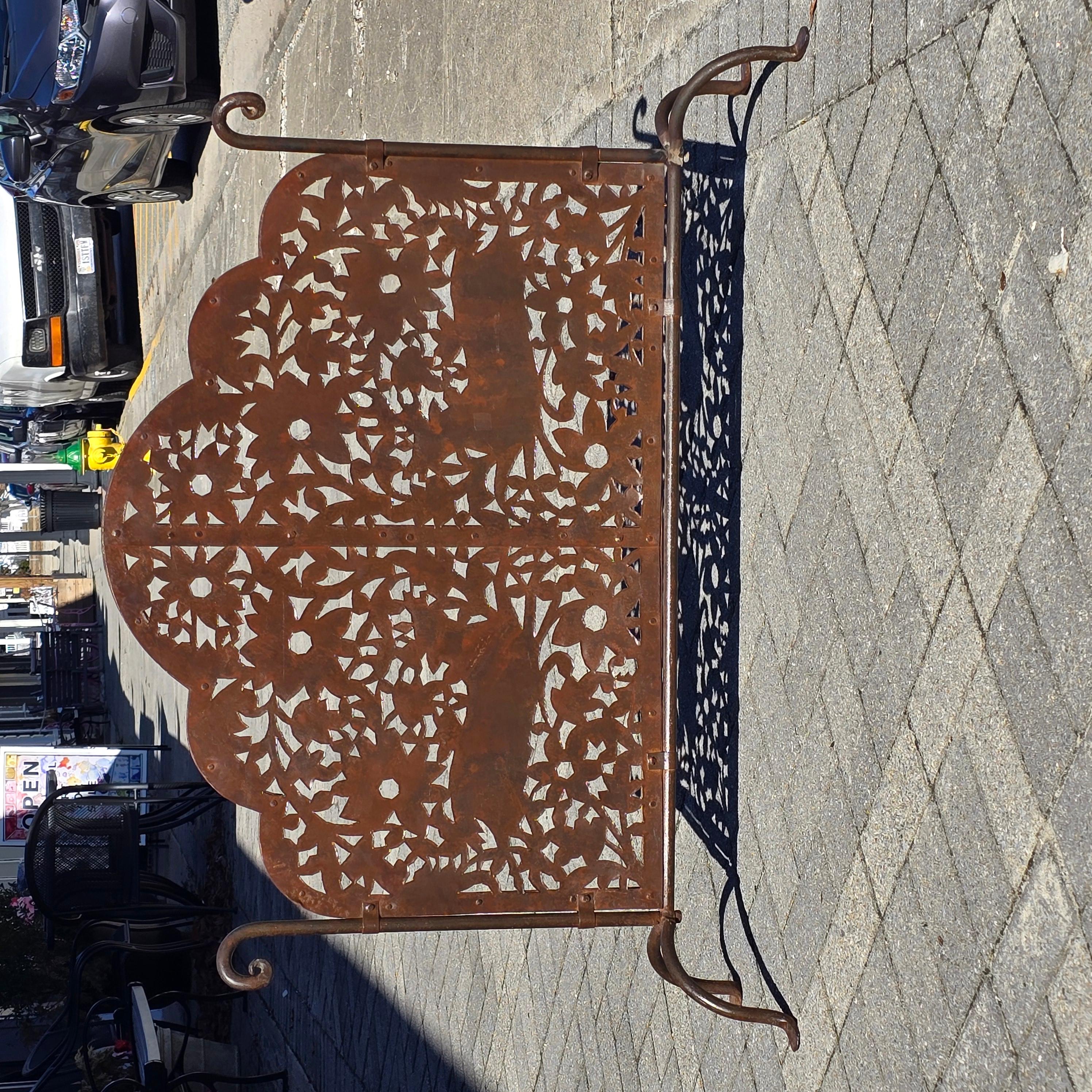 Stunning wrought iron fireplace screen with Matisse style cut outs.   The fireplace screen does a good job of balancing rustic and fancy all while being relaxed and calming.