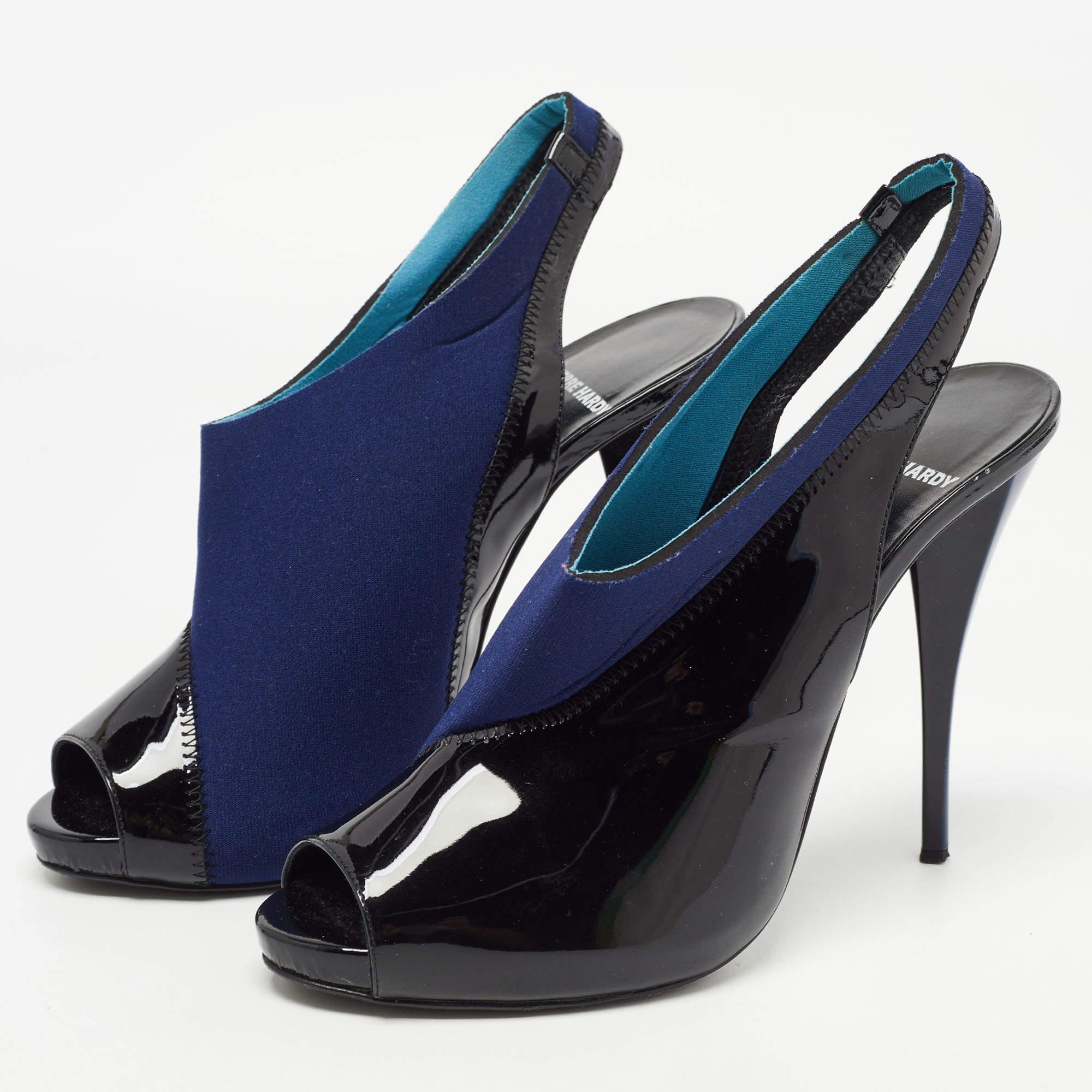 This pair of Bupumps can be defined by a contemporary and classic silhouette. Created from fabric and patent leather  the 12cm heels of these shoes will reflect luxury in every step.