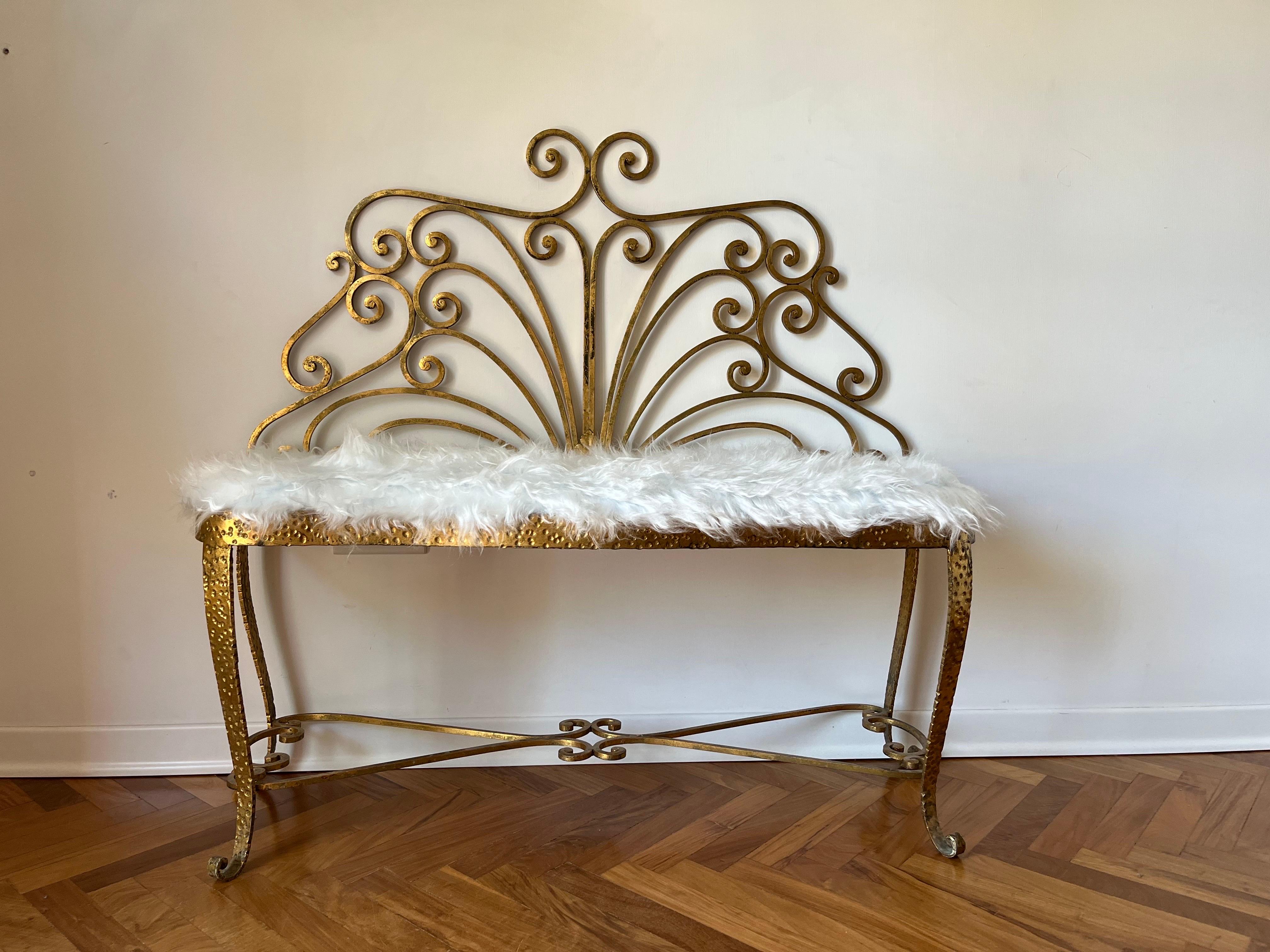 Pierluigi Colli bench and pouf from 1950, Design

Author: Pierluigi Colli, Turin 1950s

Materials: Full gilded iron, cushions redone and re-upholstered with white synthetic fur

Measurements: Bench cm 95 L x cm 44/104 H x cm 40 D; Pouf Cm 44 x