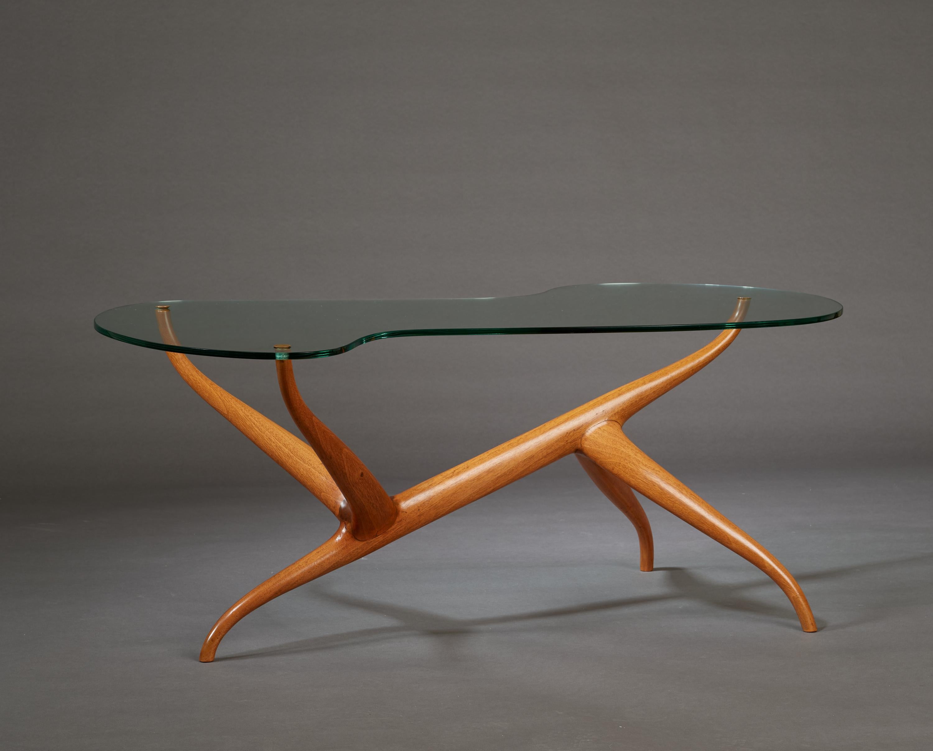Pierluigi Giordani (1924-2011)

A one of a kind sculptural coffee table by Pierluigi Giordani, and a masterwork of organic abstraction. A biomorphic glass top, inset with delicate brass rivets, floats cloud-like over an asymmetrical blond oak base