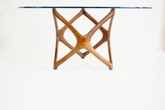 Pierluigi Giordani round coffee table, carved wood and crystal top, 1950