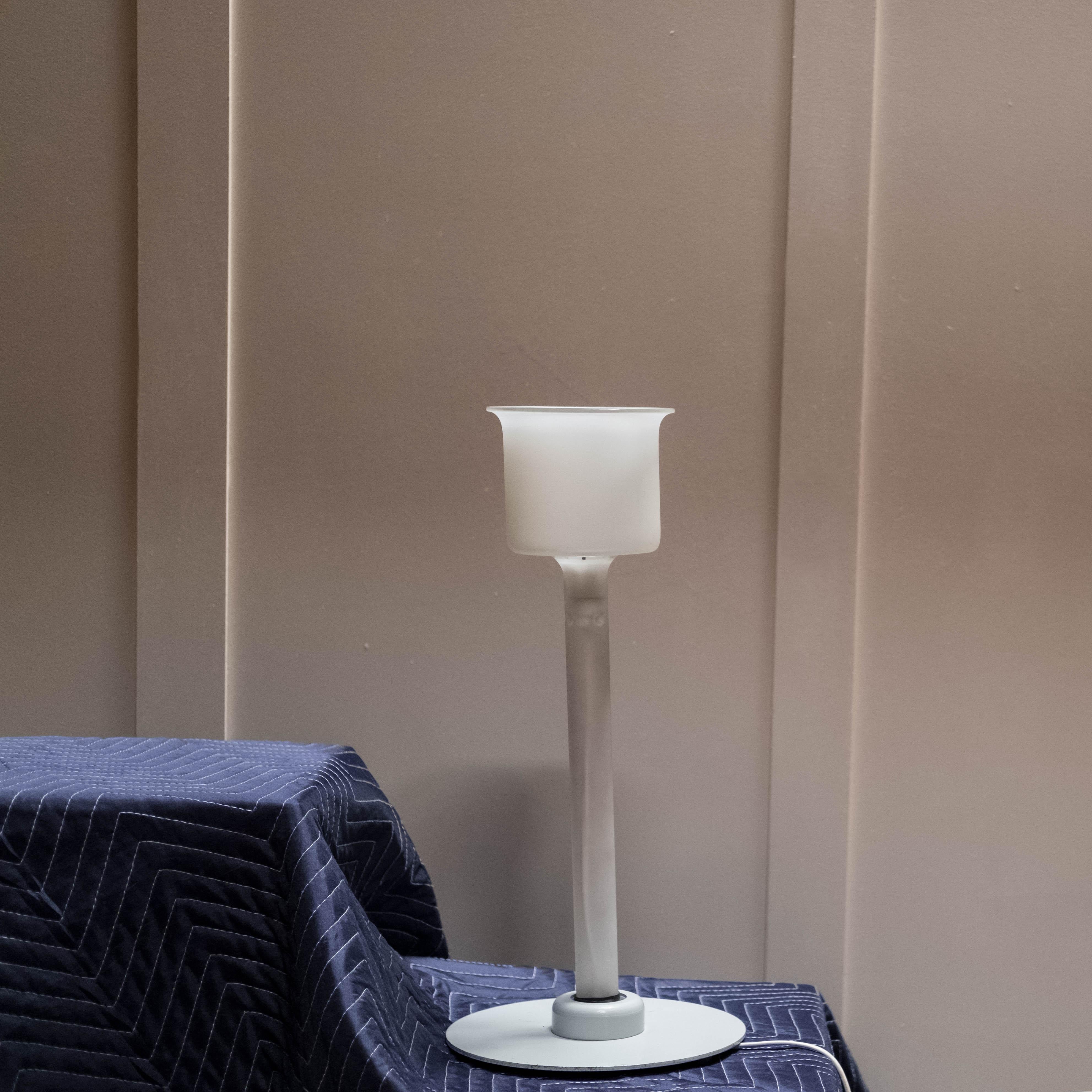 Piero Castiglioni and Roberto Menghi's 'Canna' Table Lamp, designed in 1981. The 'Canna', model 2074, showcases a refined blend of materials including frosted blown glass, glazed glass, and enameled steel. Manufactured by Fontana Arte in Italy and