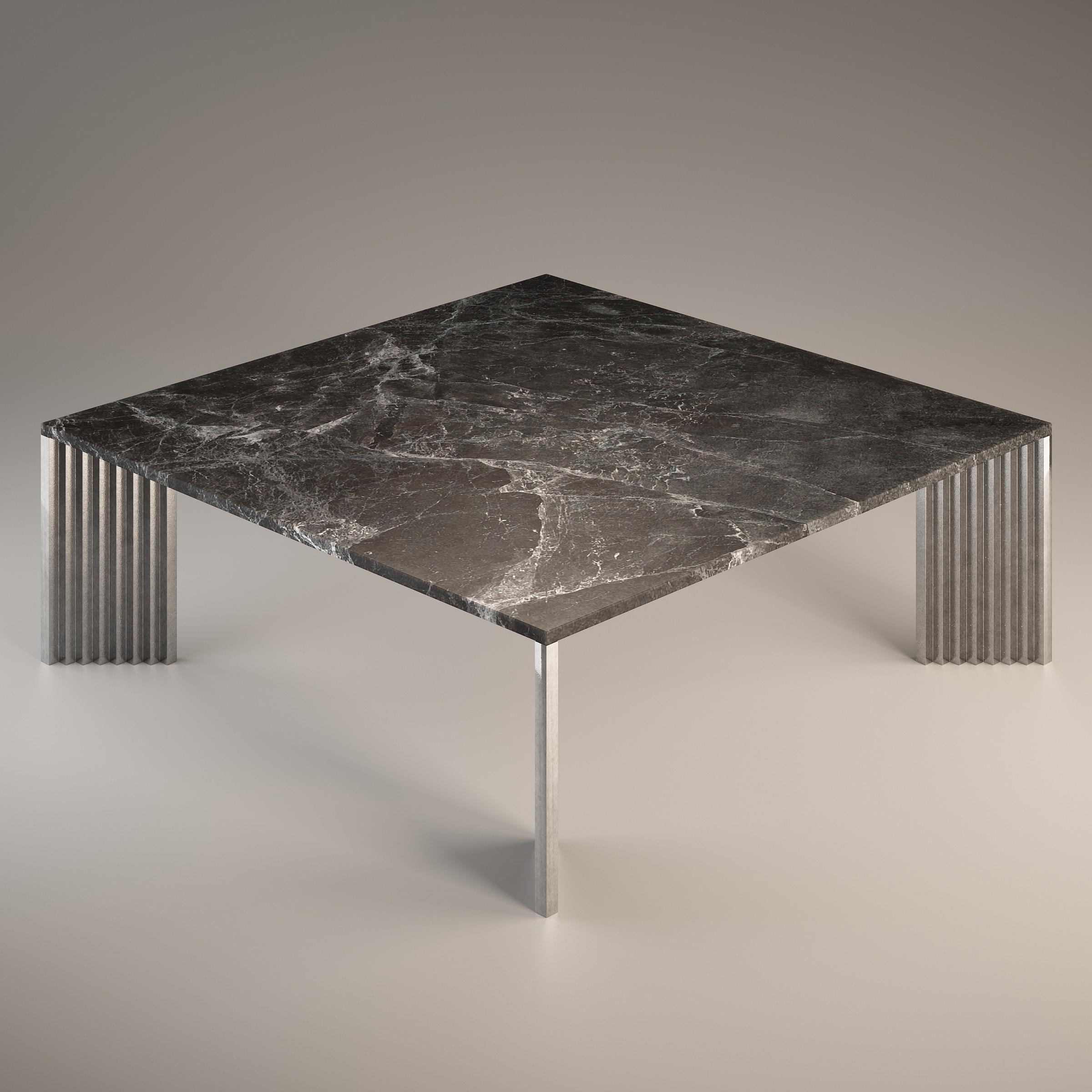 The cast aluminum legs, with their stepped profiles and diagonal position, appear differently from each viewing angle: sometimes slender, then massive, but also polished and at other times rough.

The top is in Emperador Grey, a marble that is