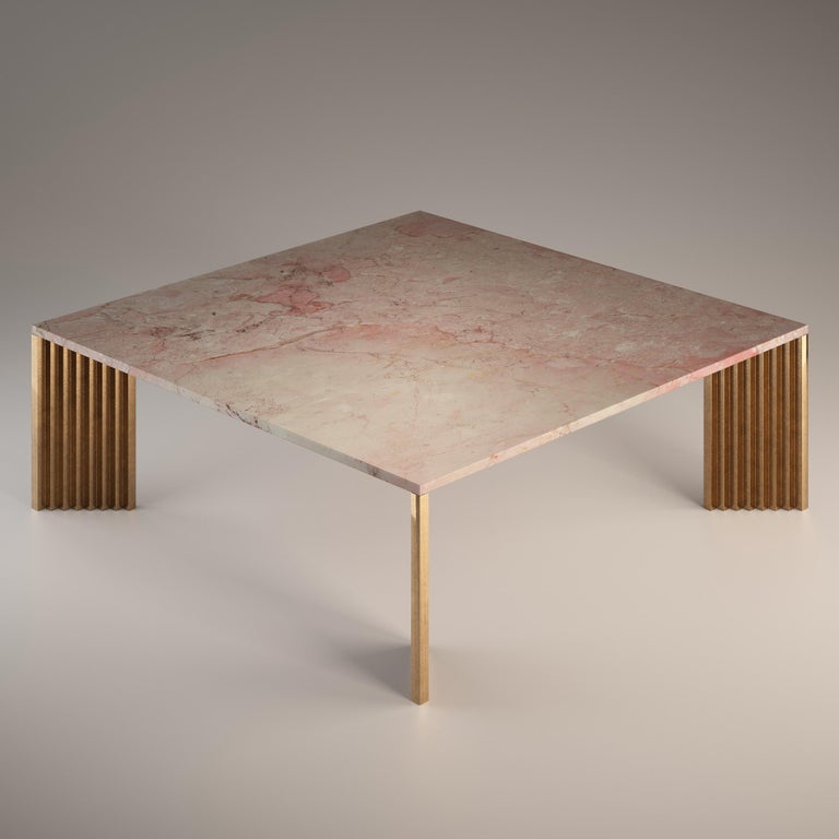 The cast bronze legs, with their stepped profiles and diagonal position, appear differently from each viewing angle: sometimes slender, then massive, but also polished and at other times rough.

The top is in Rosa Tea, a marble that is quarried in