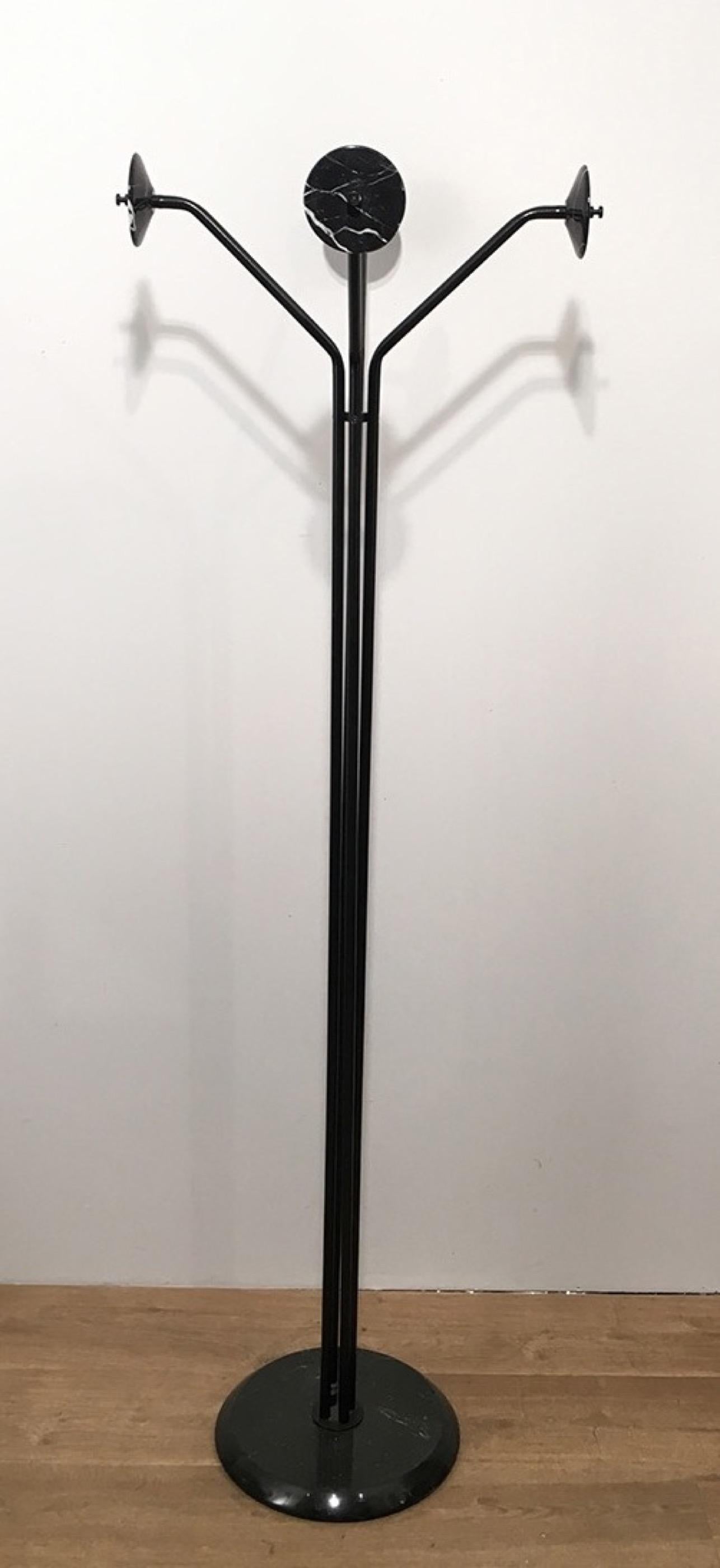 This coat rack is made of black lacquered metal and black marble. The base is made of marble as well as the hooks. This is an Italian design made by Piero de Longhi. Lolo coat rack. By Fly Line. 1978.