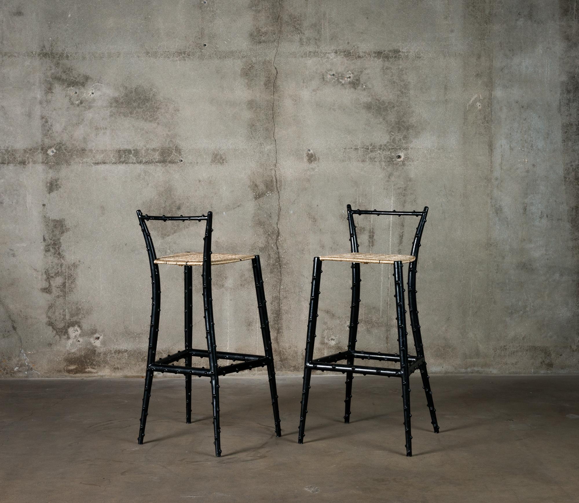 Pair of Piero Fornasetti rubber coated steel bar stools, Italy, circa 1960. Approximately twenty examples of this rare form were produced. These works have been authenticated by Barnaba Fornasetti.