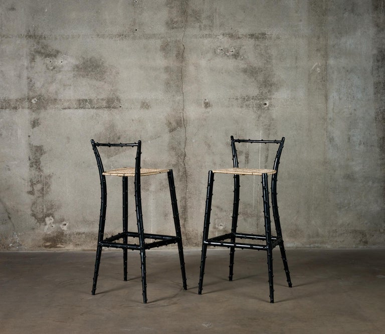 Pair of Piero Fornasetti rubber coated steel bar stools, Italy, circa 1960. Approximately twenty examples of this rare form were produced. These works have been authenticated by Barnaba Fornasetti.