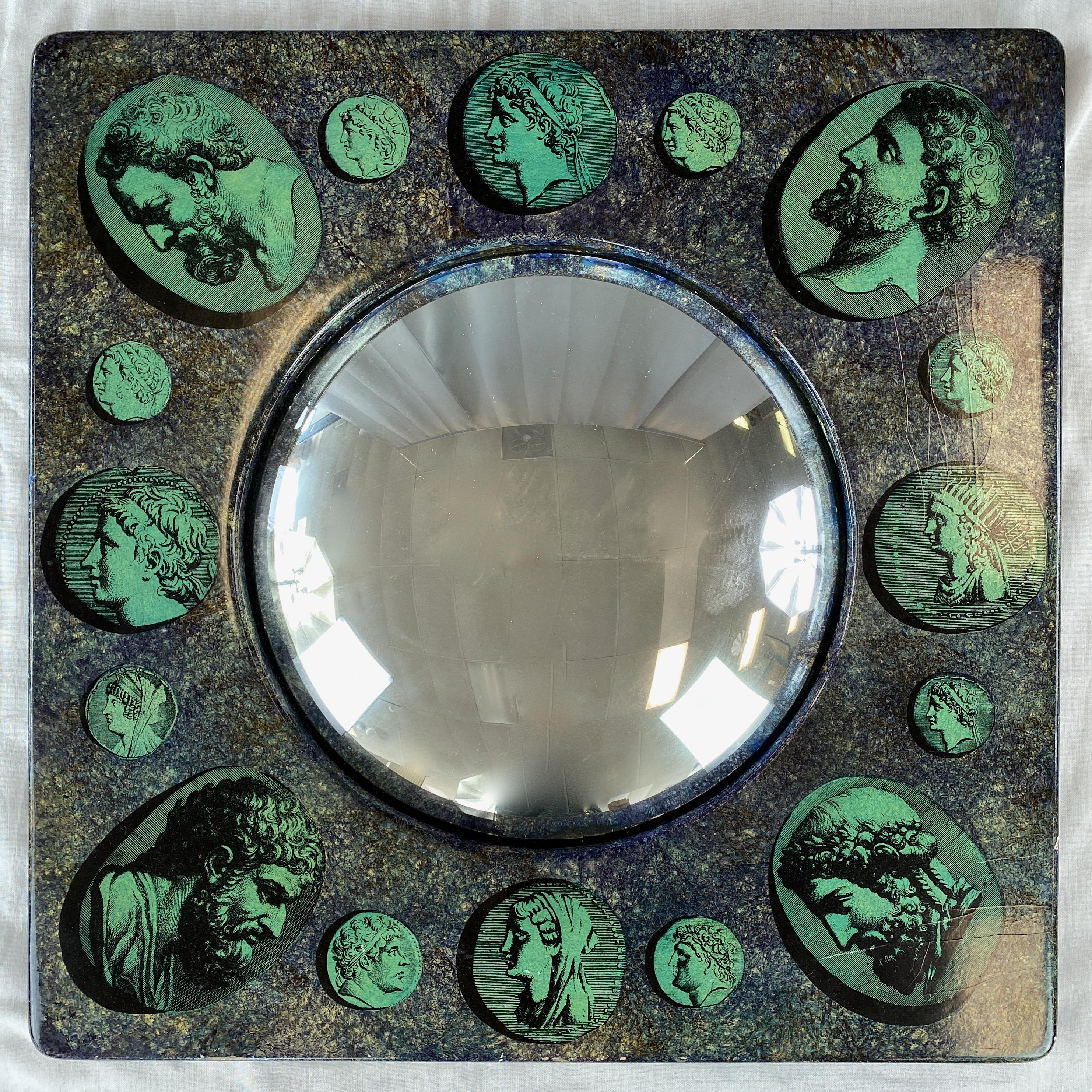 A rare and arresting 1956 square Cammei convex mirror in a seldom seen colorway by iconic Italian artist & designer Piero Fornasetti (b. 1913–1988).

Emerald green transfer-printed and applied cameos (“cammei”) of sixteen Roman gods and goddesses