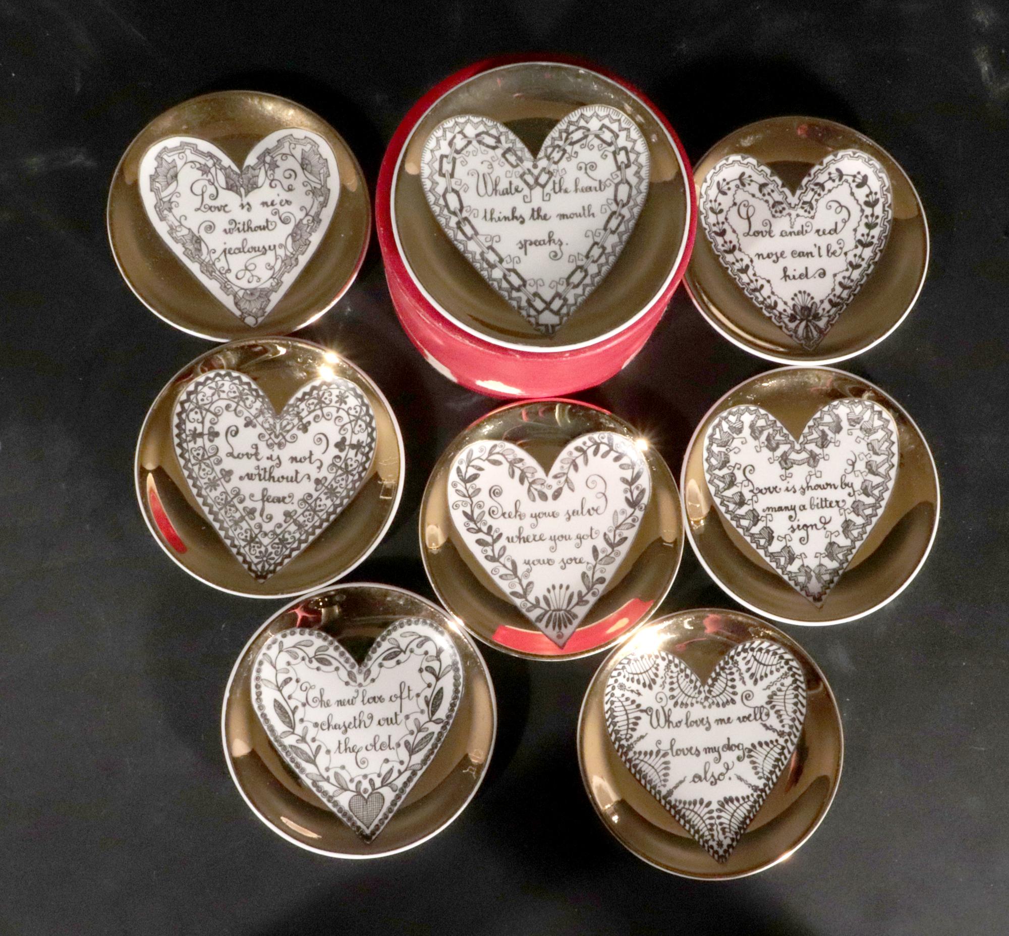 Piero Fornasetti Ceramic Coasters with Hearts and Sayings about Love,
With Original Red Box,
1950s-early 60s.

Each of the eight coasters has a central white heart on a gold ground.  Within each heart is a saying about love framed by a different