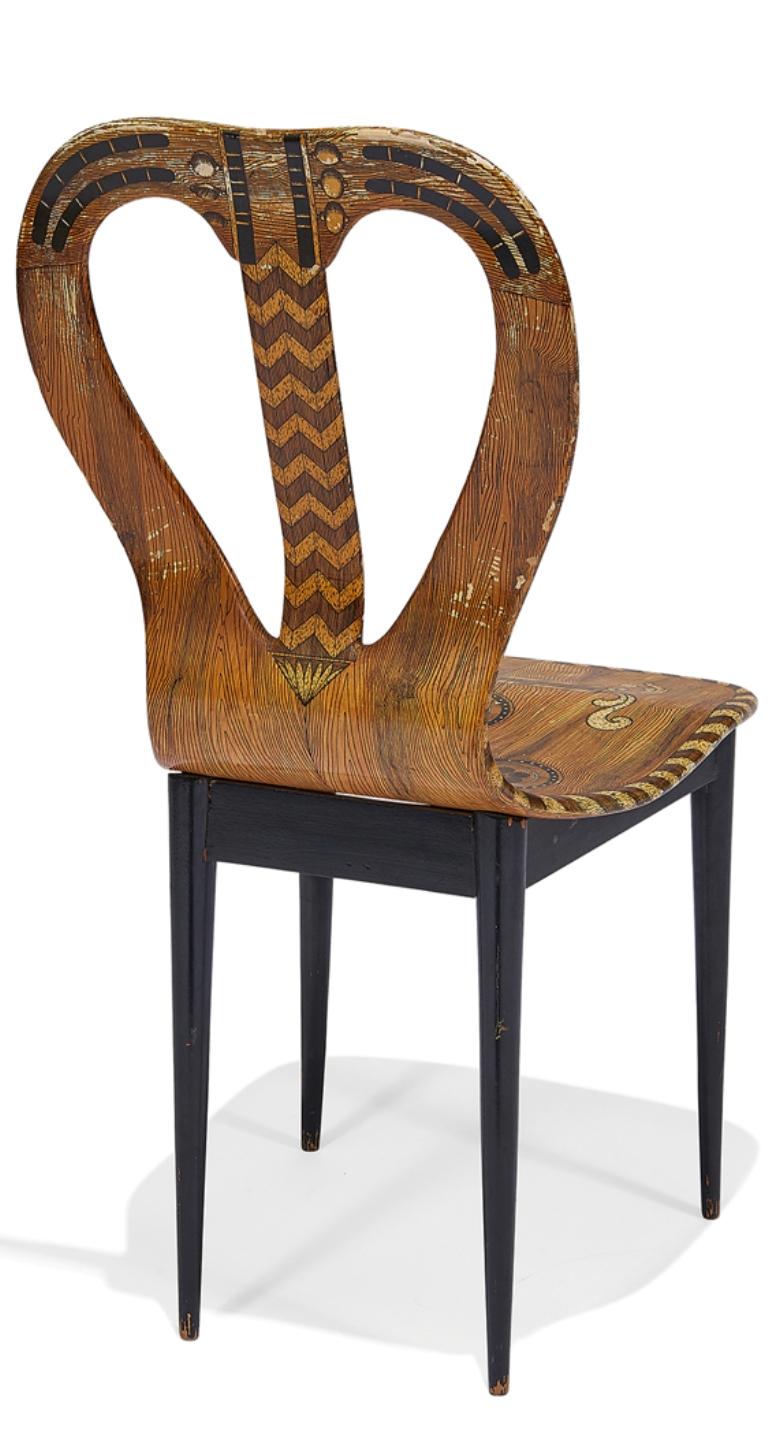 Beautiful and unique Piero Fornasetti musical chair, Italy, 1960s. Lacquered and hand painted wood, hand-stamped and original paper label to underside.