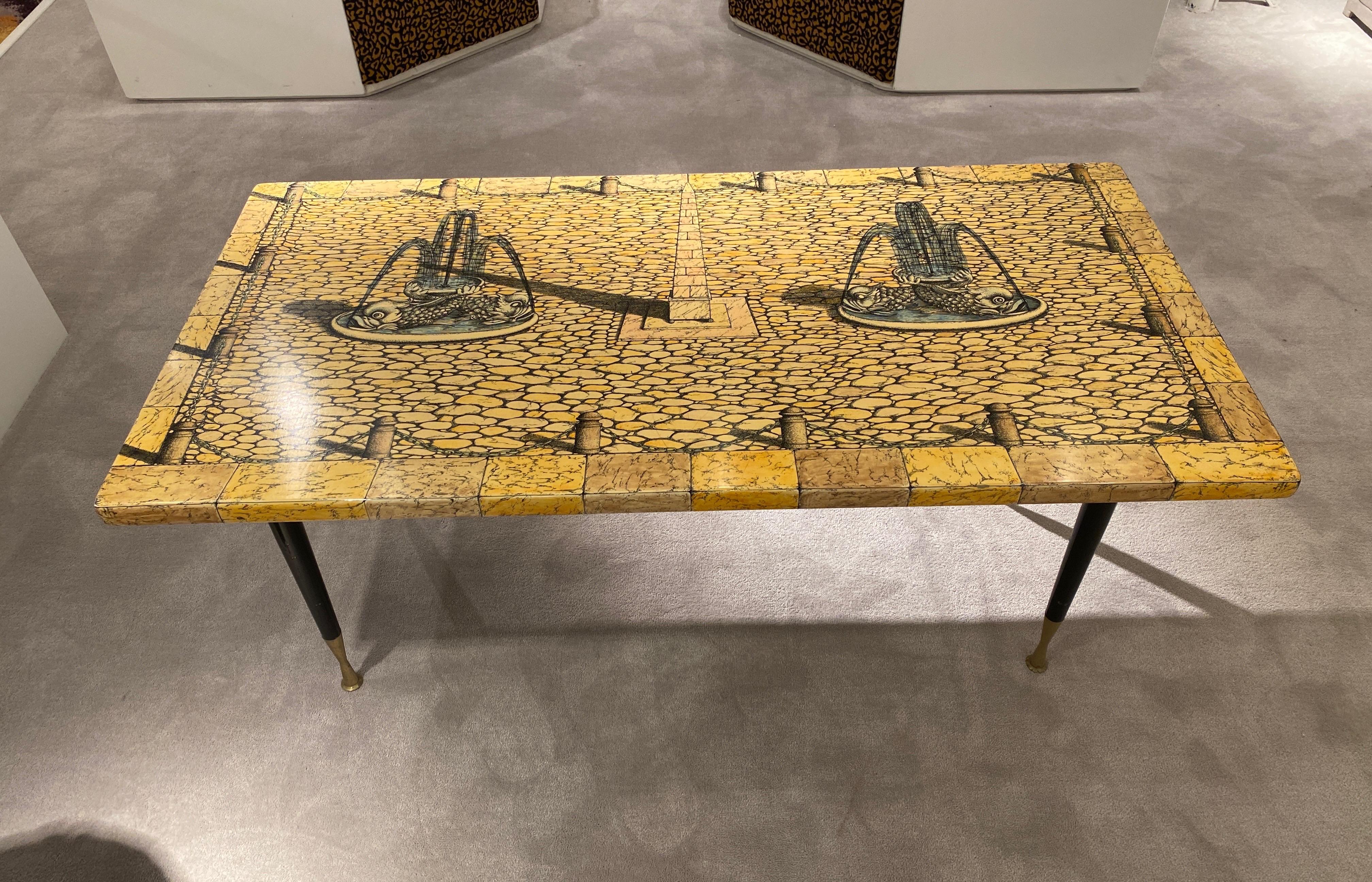 Coffe table by Piero Fornasetti 
Black and white Architectura series
Italy circa 1960
Stamped with original sticker
Black lacquered feet with brass details.
 