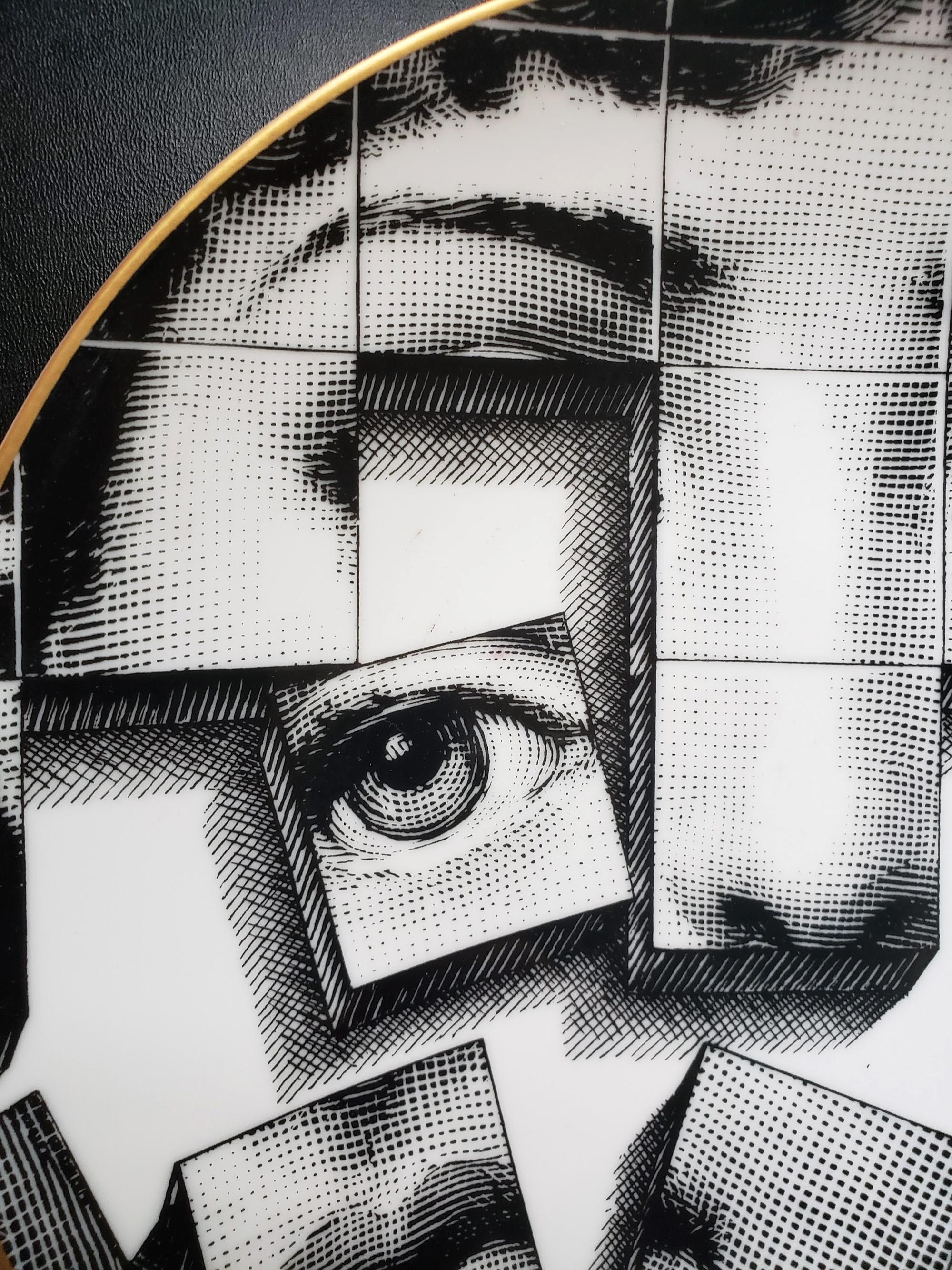 Piero Fornasetti cubist rosenthal plate,
Motiv 33, 
Themes & variation

The unusual Cubist vision of Lina Cavatelli is number Motiv 33 and depicts the famous face of the opera singer Lina with a disintergrating grid of her face.

Dimension: 9