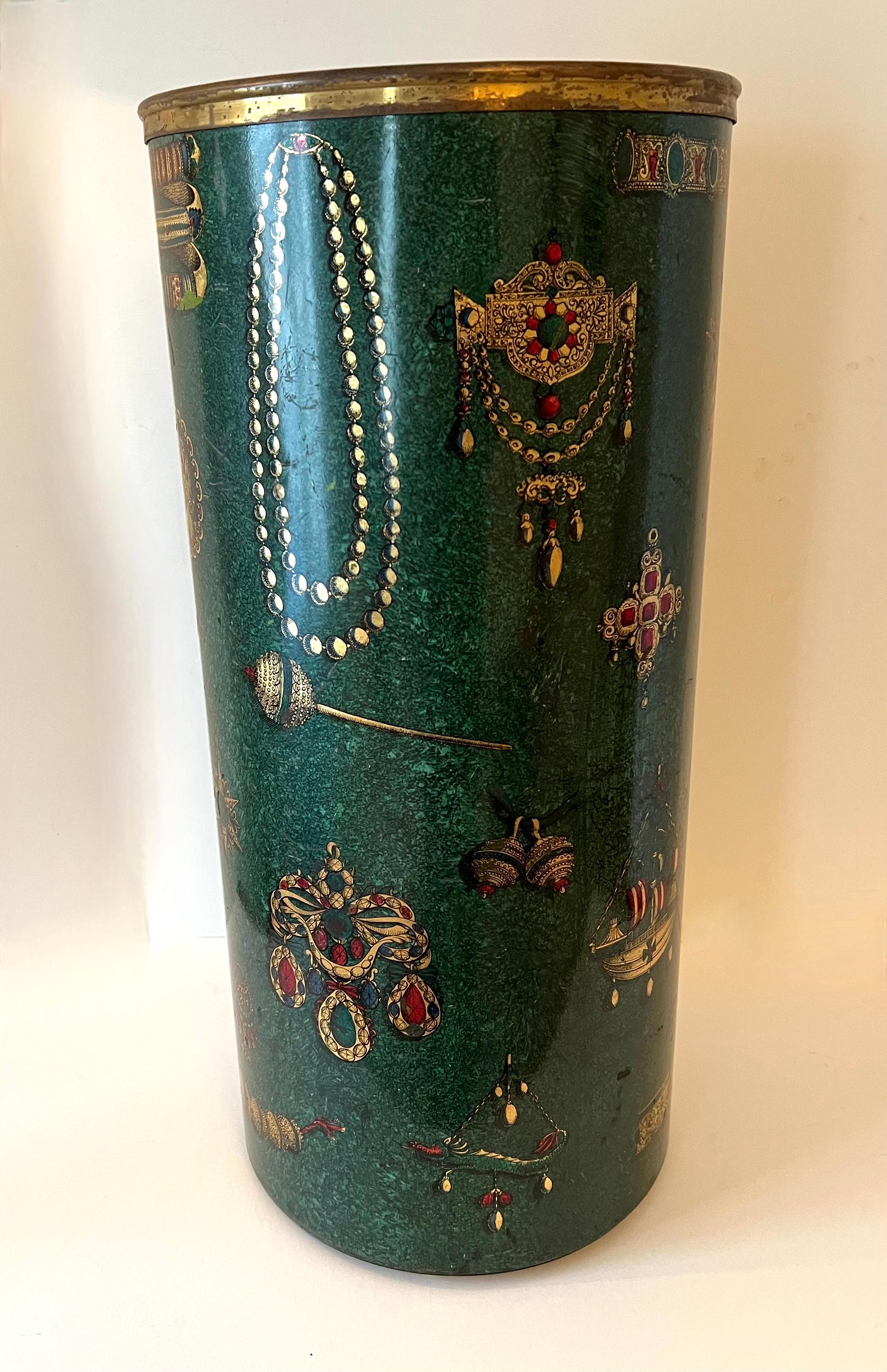 Piero Fornasetti enamel Umbrella stand. A large and important piece, not only in stature, but in epic design. The stand is a wonderful saturated Green enamel wiht images of jewels, Sailing ships, medals, etc. Own a piece of art that has and will