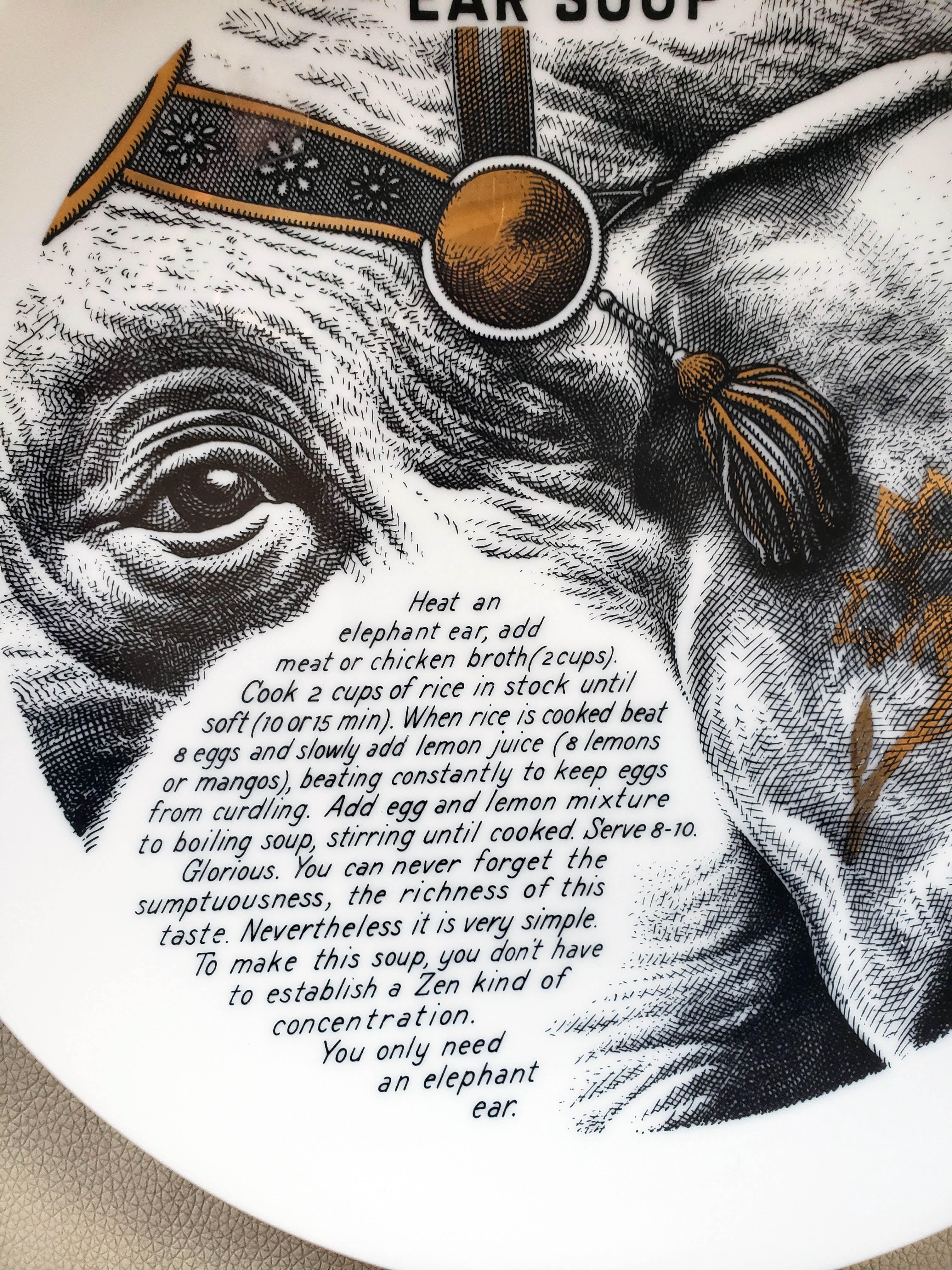 Piero Fornasetti Fleming Joffe Porcelain Recipe Plate,
Elephant Ear Soup,
1960s.

This rare Piero Fornasetti porcelain plate is from a series of fourteen made for the Fleming Joffe company in New York City. These plates were given away by the hide