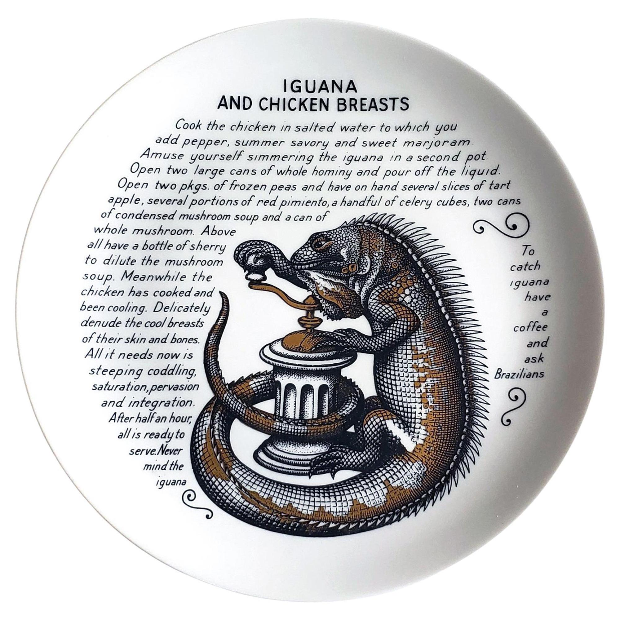 Piero Fornasetti Fleming Joffe Porcelain Recipe Plate,
Iguana and Chicken Breasts,
1960s-1974.

This rare Piero Fornasetti porcelain plate is from a series of fourteen made for the Fleming Joffe company in New York City.  Note very slight rubbing on