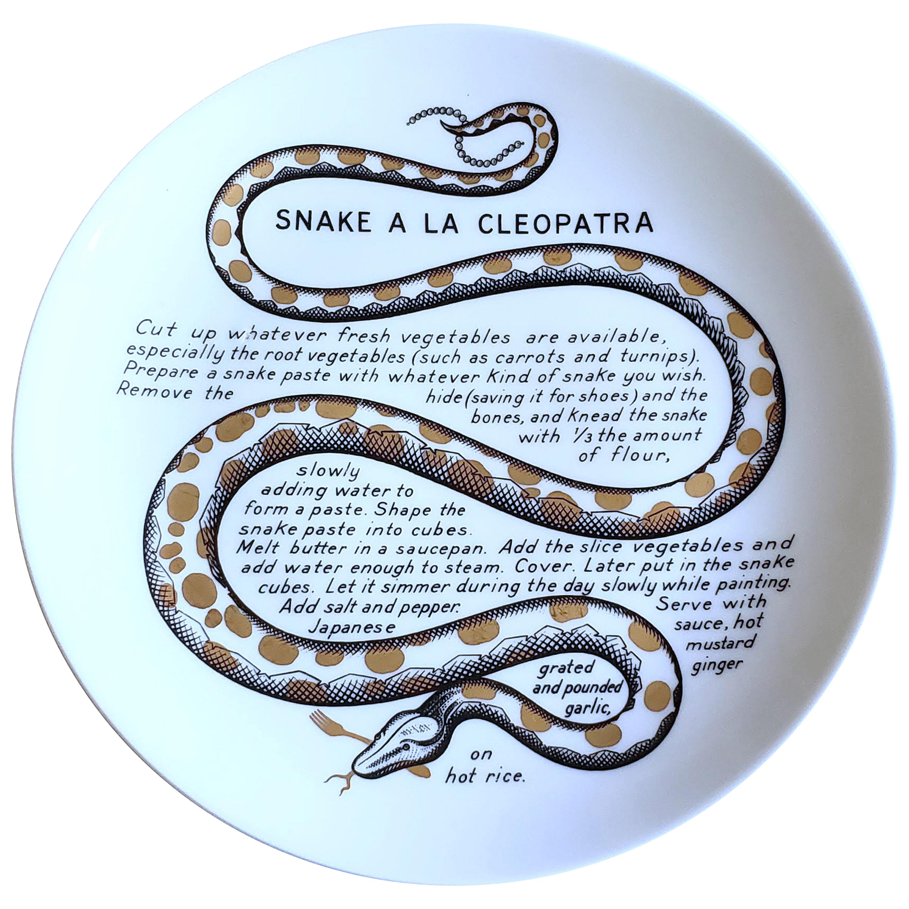 Piero Fornasetti Fleming Joffe Porcelain recipe plate,
Snake a la Cleopatra,
1960s-1974.

This rare Piero Fornasetti porcelain plate is from a series of fourteen made for the Fleming Joffe company in New York City.

The plate originally was in