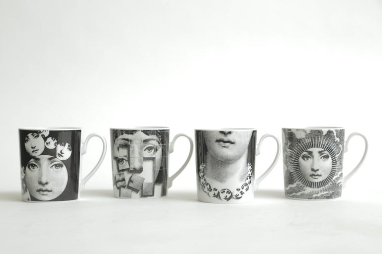 This set of  4 Piero Fornasetti serigraphed transfer porcelain coffee or tea mugs for Rosenthal Classic Germany are from the 1980s. They are from the Julia Collection of Lina Cavalieri. It is hallmarked on the bottom Rosenthal Classic Germany Dekor