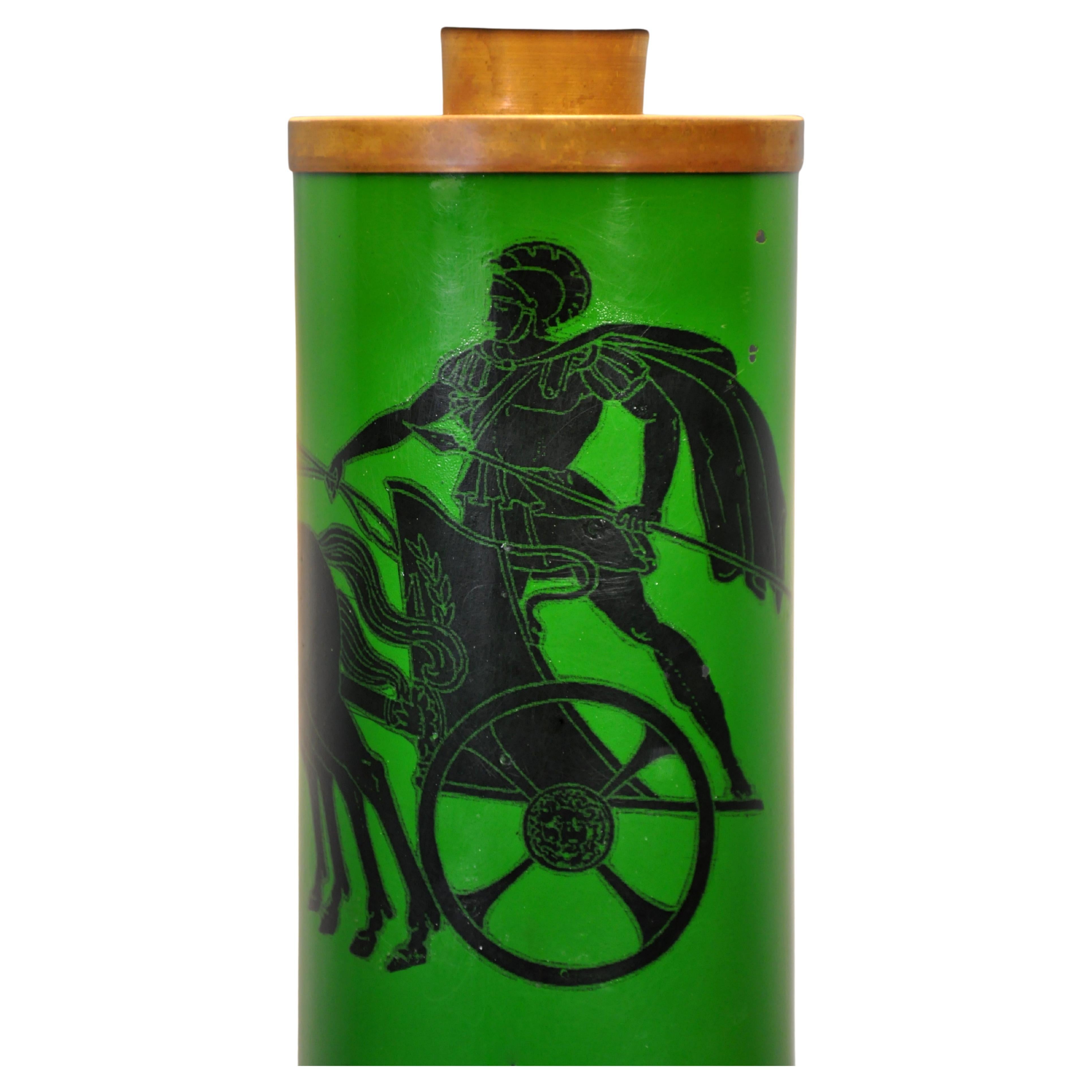 A vintage Mid-Century Modern lamp by Piero Fornasetti, the Italian master celebrated for his playful and surreal self-expression. Its striking green body showcases Neoclassical style screen-printed motifs of gladiators on chariots with horses. With