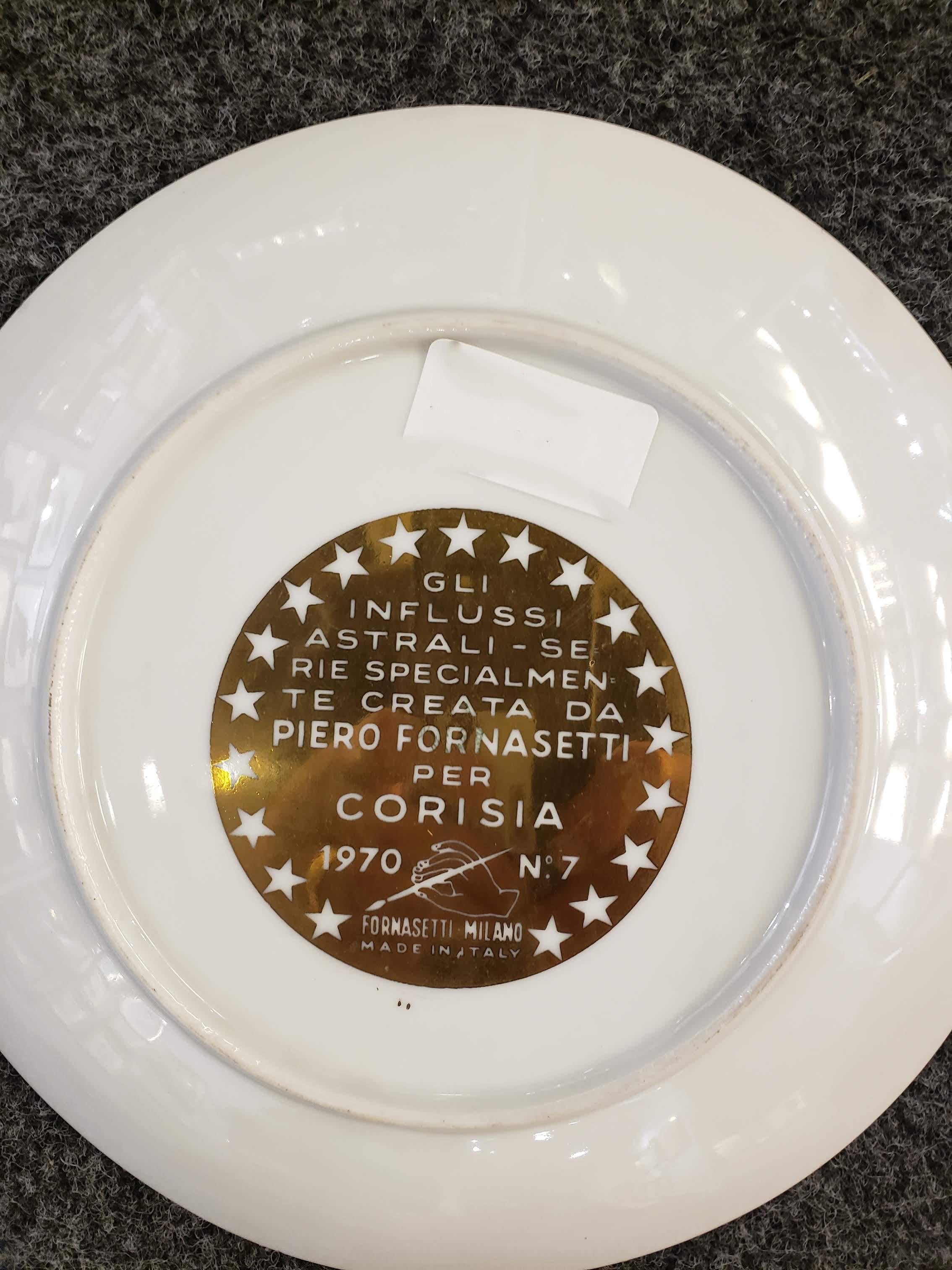 Piero Fornasetti Libra zodiac porcelain plate made for Corisia in 1970.

The plate in black and gold depicts the astrological sign Libra with words, intertwined around the form of hanging scales, with characteristics of the sign. This series of