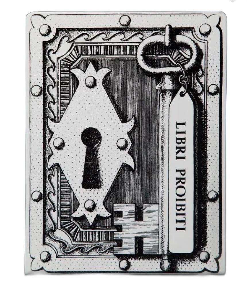Fornasetti - Libri Proibiti Bookends, Italy 1950's. Pair of hand silkscreened metal bookends is embellished with the Libri Proibiti (Forbidden Books). Original
Measure 8