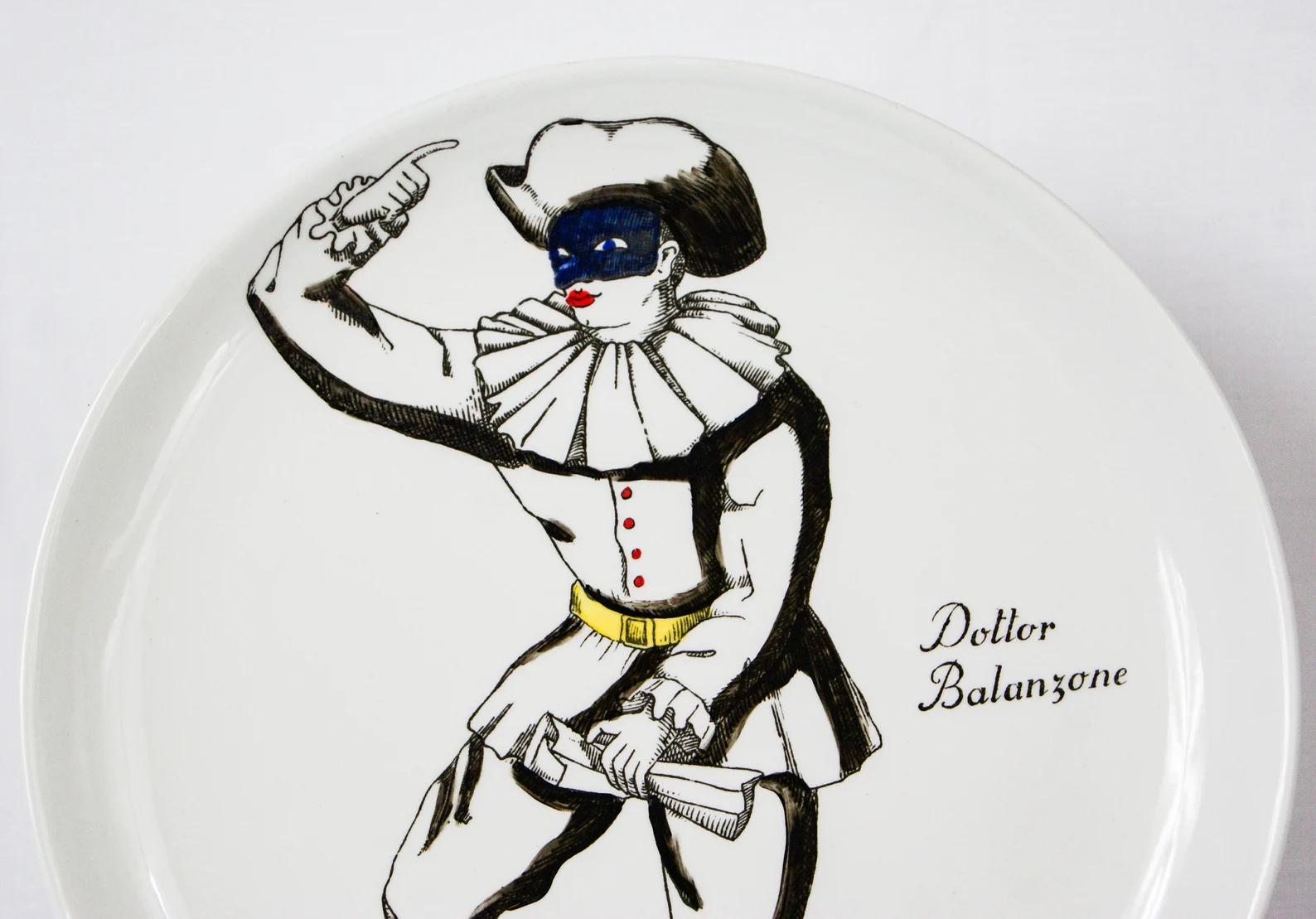 Rare Piero Fornasetti Milano porcelain dish.
From the Commedia Dell'arte collection.
Depicting Dottor Balanzone in white with a blue mask and red boots.
Comes with detachable wall hanging clip.
Signed at the base.
  