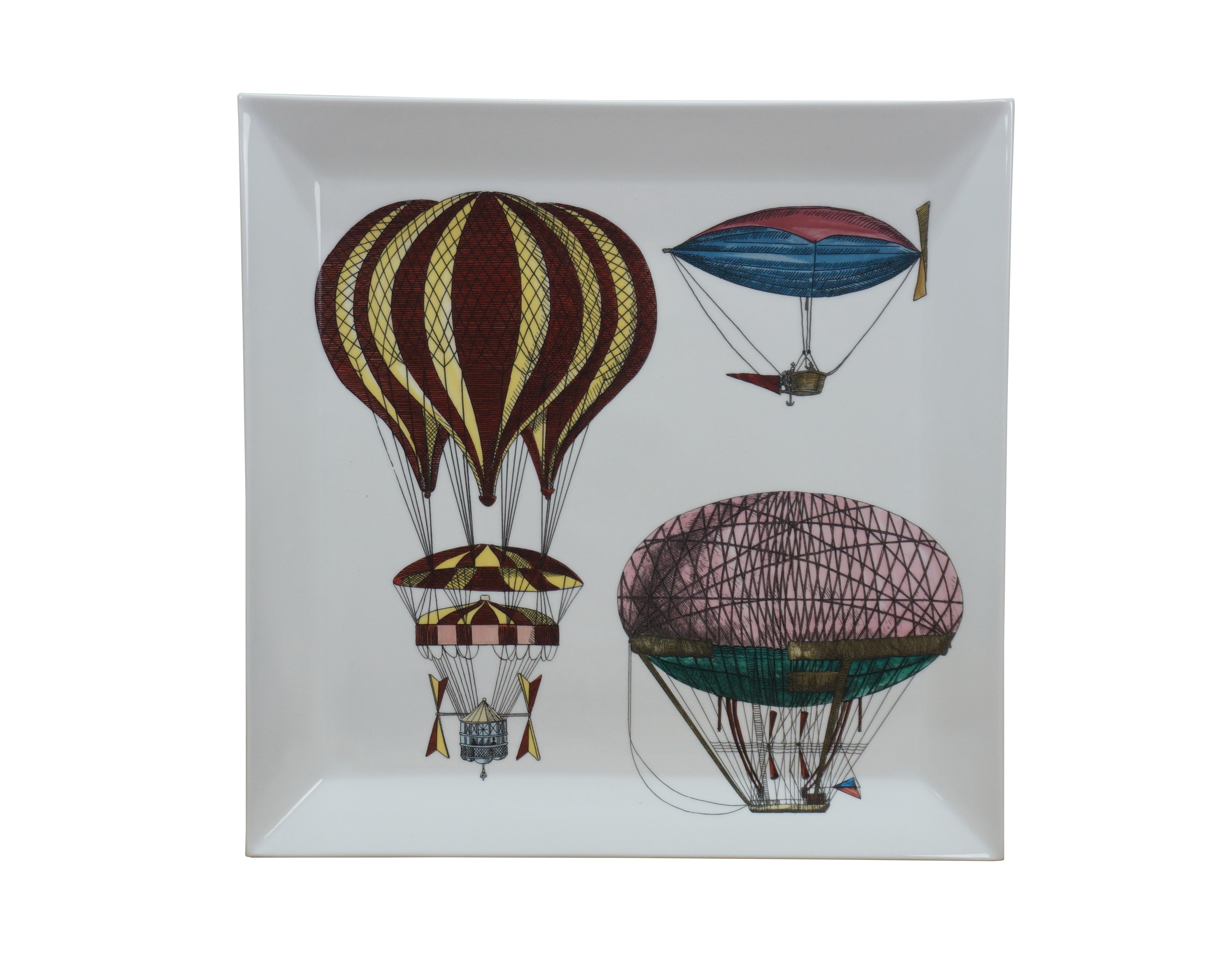 Fornasetti Palloni Tray n.2 -  square porcelain serving plate / platter decorated with a variety of antique hot air balloons. This hand-painted and decorated square tray is part of Fornasetti's series dedicated to hot-air balloons and airships. This