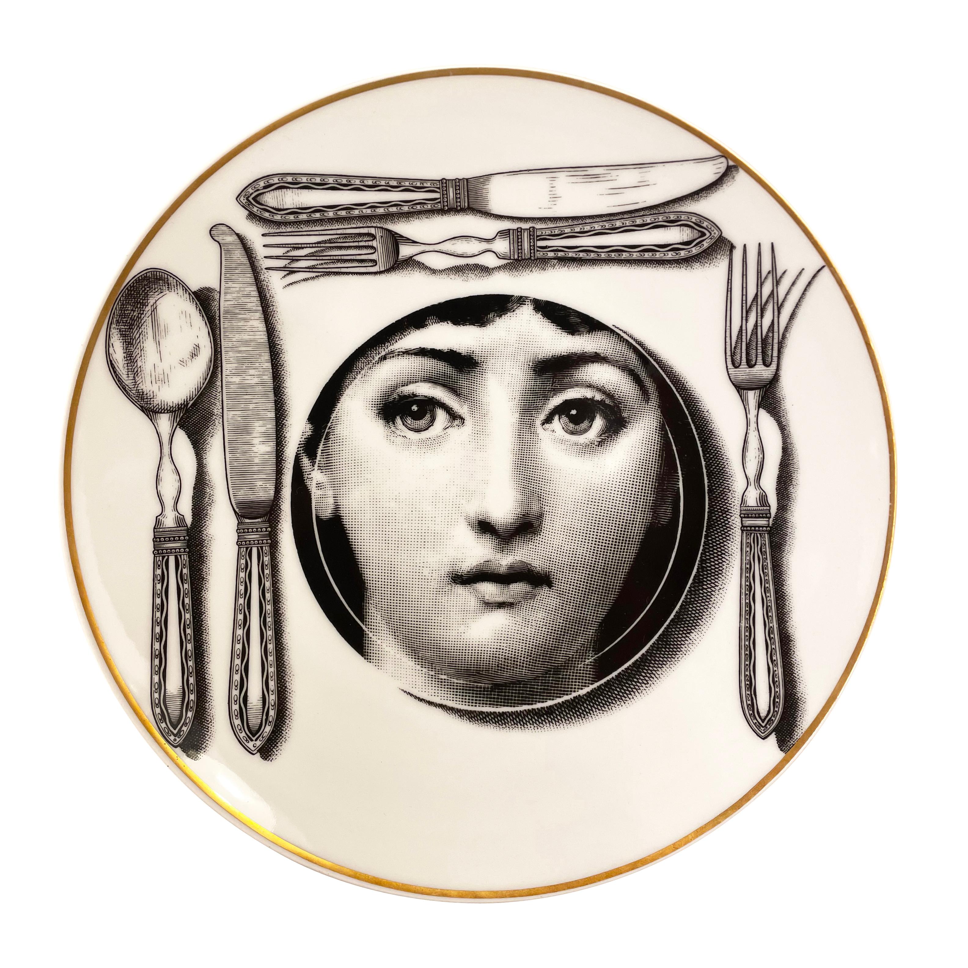Piero Fornasetti ceramic plate made by Ronsenthal in the 1980s. From the “Temi e Variazioni” series portraying Fornasetti’s fictional character, Giulia. Original box included. 

Condition: Excellent vintage condition, minor wear consistent with