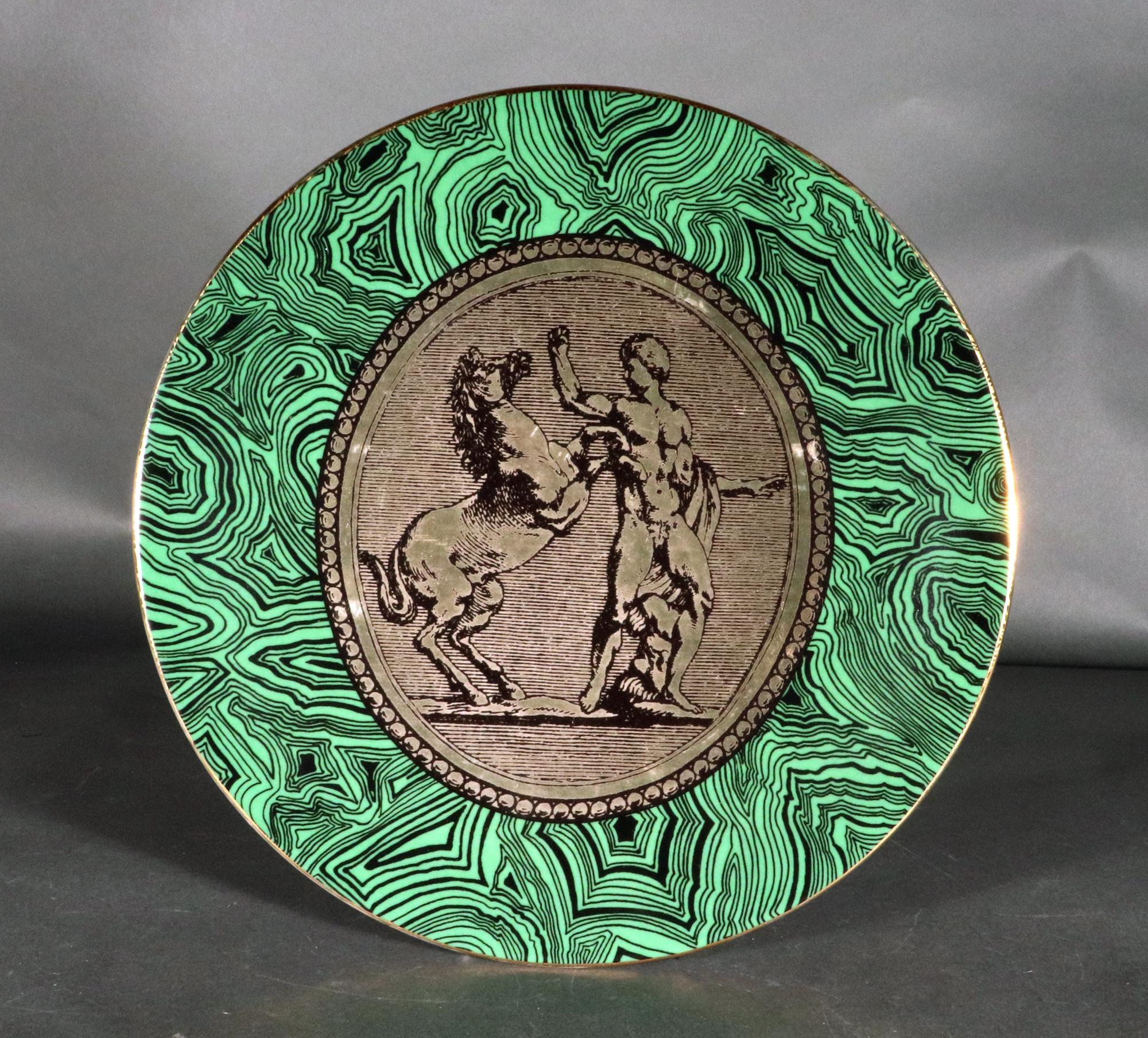 Piero Fornasetti Porcelain Green Malachite Cammei Plate,
Cammei or Cameo,
Circa 1950s-60s
From a group of Five.

The Piero Fornasetti porcelain plate, named Cammei on the reverse, meaning Cameo, has a ground of green malachite with a central panel