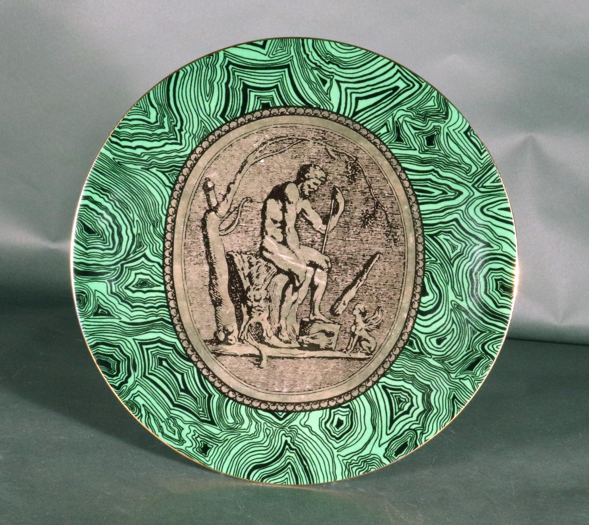 Piero Fornasetti Porcelain Green Malachite Cammei Plate,
Cammei or Cameo,
Circa 1950s-60s

From a set of five which are each sold individually.

The Piero Fornasetti porcelain plate, named Cammei on the reverse, meaning Cameo, has a ground of green
