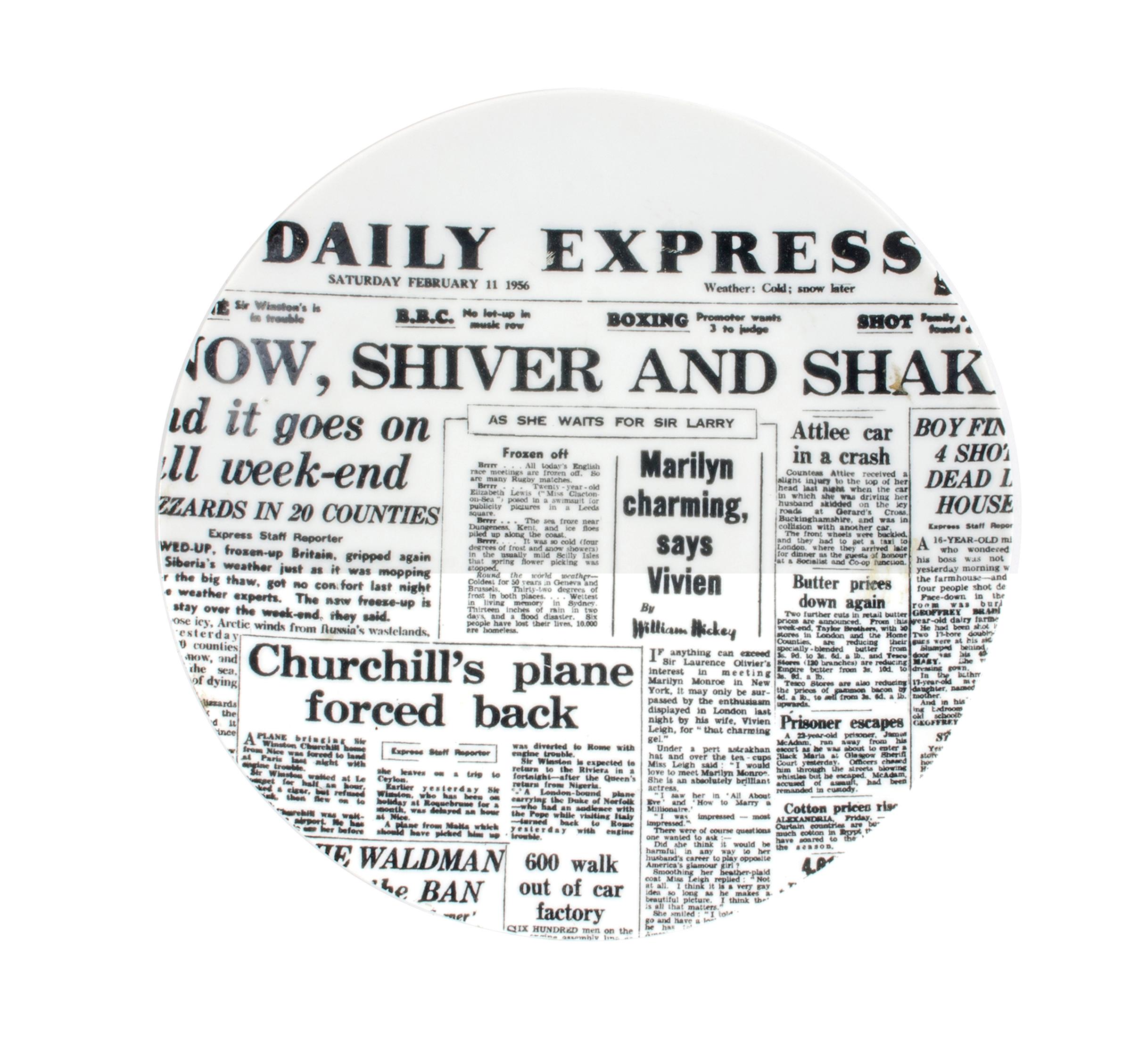 Piero Fornasetti porcelain newspaper plate,
Daily Express,
Giornali (Newspapers)
Late 1950s.
(NY8534B)

The Piero Fornasetti porcelain plate depicts the front page of the Daily Express from Saturday, February 11, 1956, with the main headline