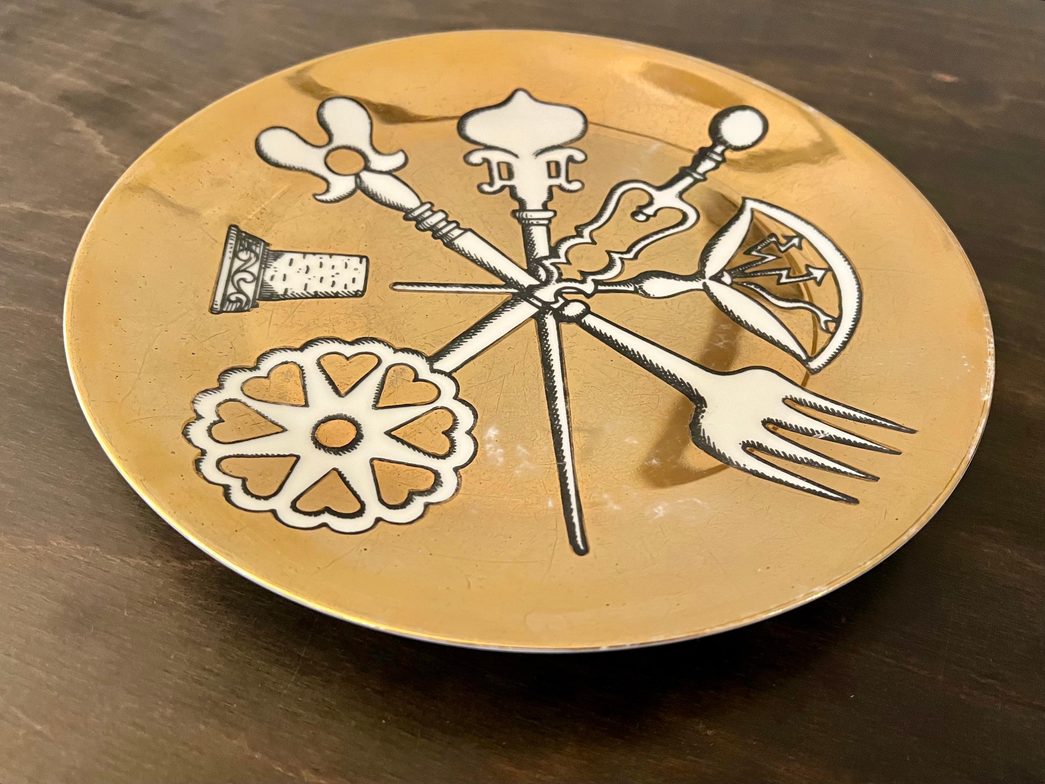 Vintage Rare Piero Fornasetti for Posateria porcelain plate circa 1956, beautiful rare piece no chips or cracks but its worn a bit faded due to age.