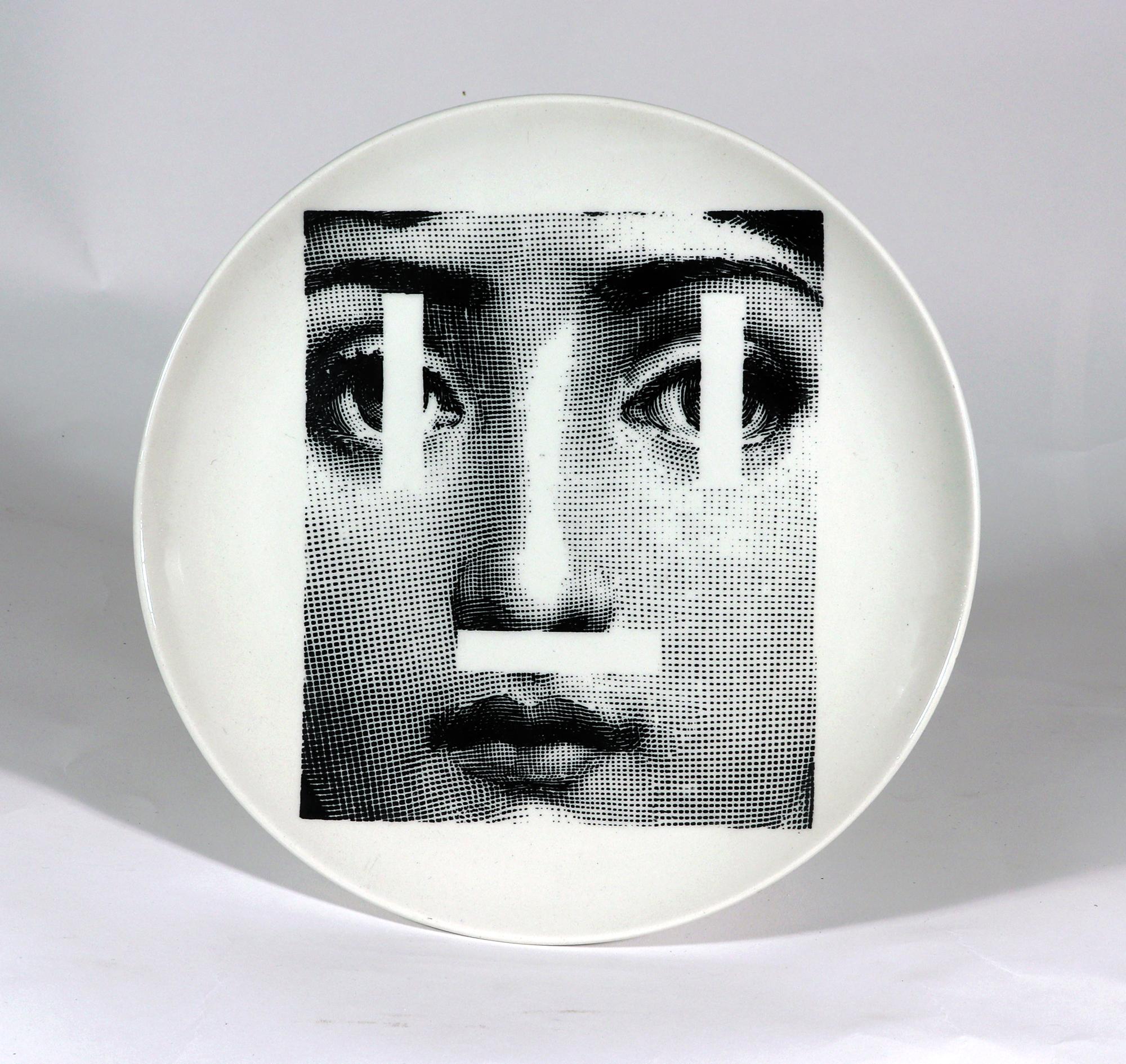 Piero Fornasetti pottery themes & variation plates
Patterns #27, 30, 58, 63, 67,& 70
Circa 1960s

The surreal Piero Fornasetti pottery plates in the Themes & Variations pattern are printed in black and white and each depicts the face of Lina