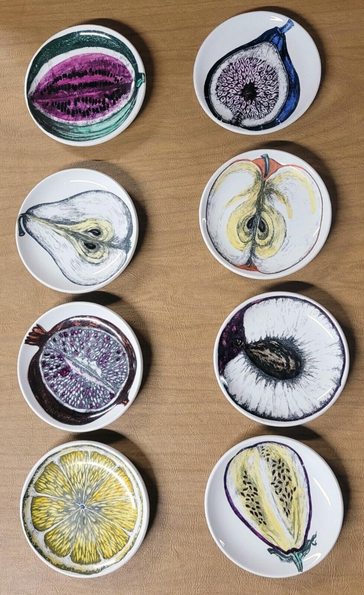 Piero Fornasetti set of eight Coasters Sezioni di Frutta Pattern,
With Original Gold Box,
Circa 1960s.

This is a fantastic and rare series with sections of different fruits depicted in rich color and detail. The most incredible