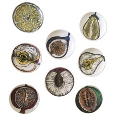 Ensemble de huit sous-verres Piero Fornasetti à motif Sezioni Di Frutta:: circa 1960s