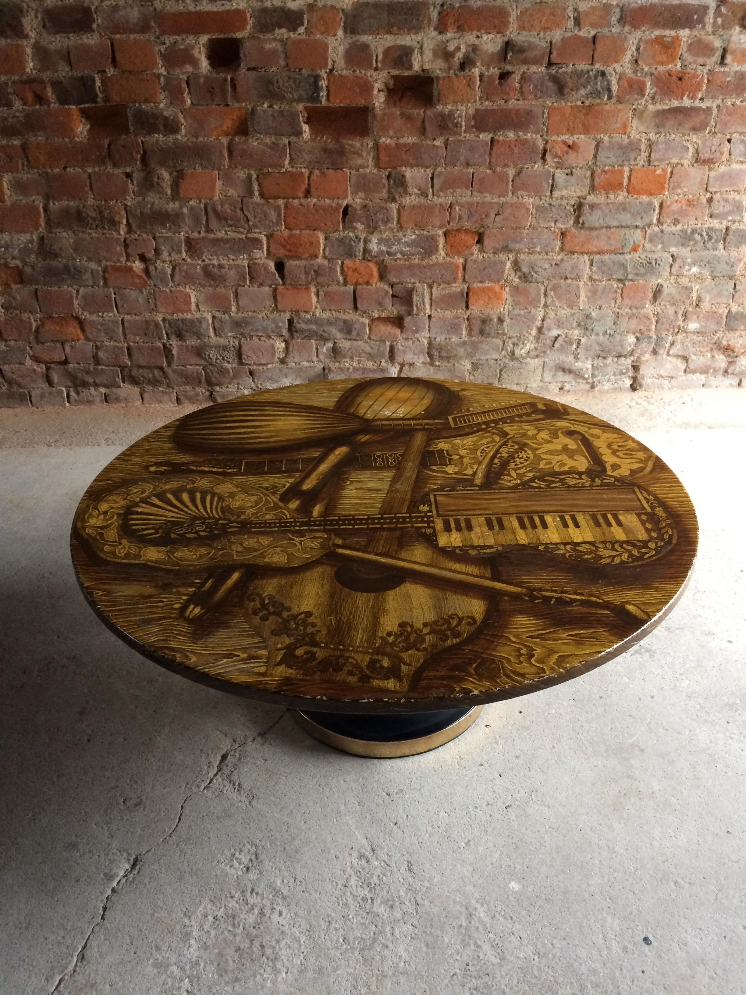 Magnificent Piero Fornasetti, Italy, 1960s circular Musical Instrument coffee table, or 'Strumenti Musicali' with musical instrument design top, on black enamelled metal base with brass strip.

Condition: This item is offered in good original