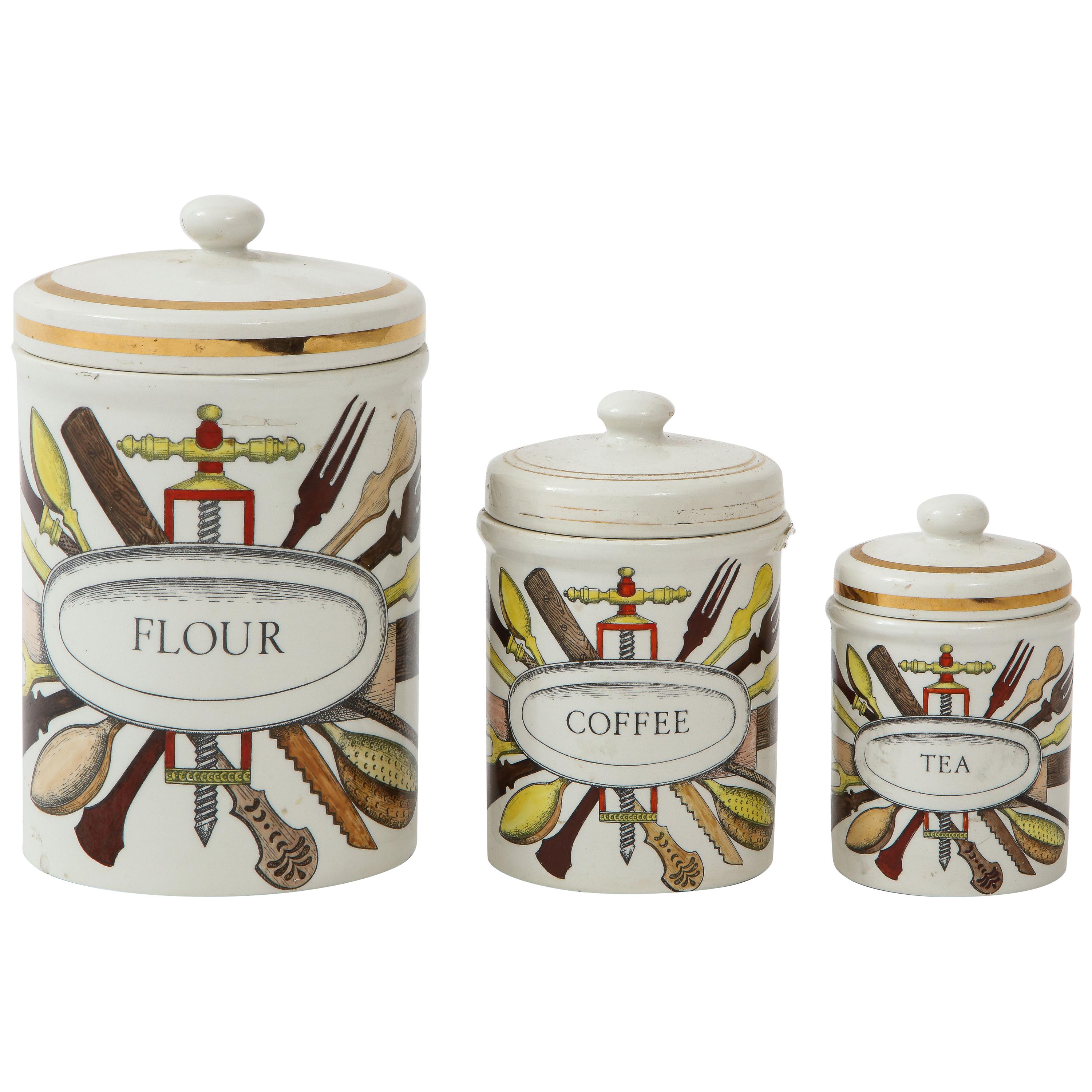 Piero Fornasetti vintage ceramic storage jars, Italy, 1960s.
Flour, coffee, tea
There is a sugar one as well from the same collection but the top is missing. Pictures upon request.
Rare set. Largest one is 12 inches high and 7 inches in diameter.