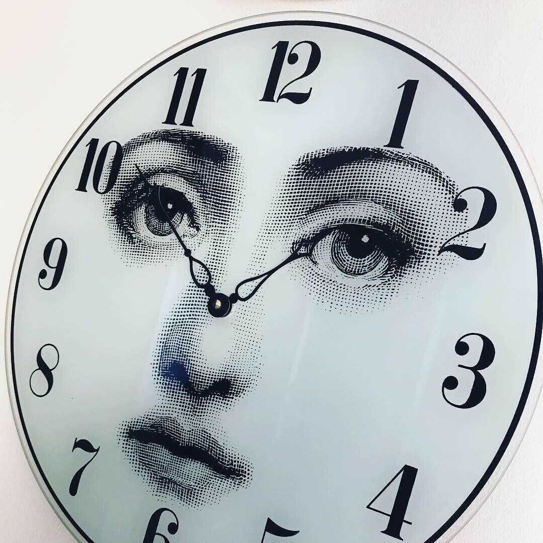Piero Fornasetti wall clock created in 1990s. Glass clock face with printed woman face and digits with Quartz clockwork. Measures: Ø 37 cm.