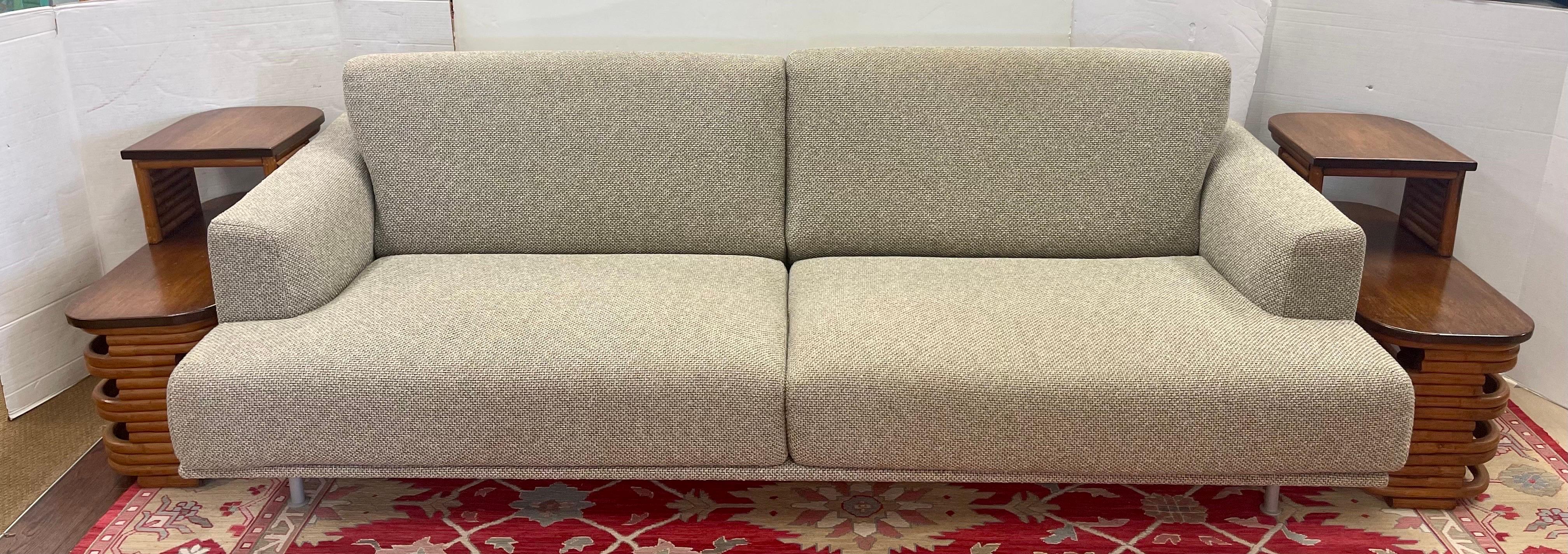 Rarely available Cassina three seat sofa with oatmeal fabric designed by renowned designer Piero Lissoni and coupled with Paul Frankl side tables also available. A marriage made in heaven! All dimensions of sofa are below. Great condition. Great