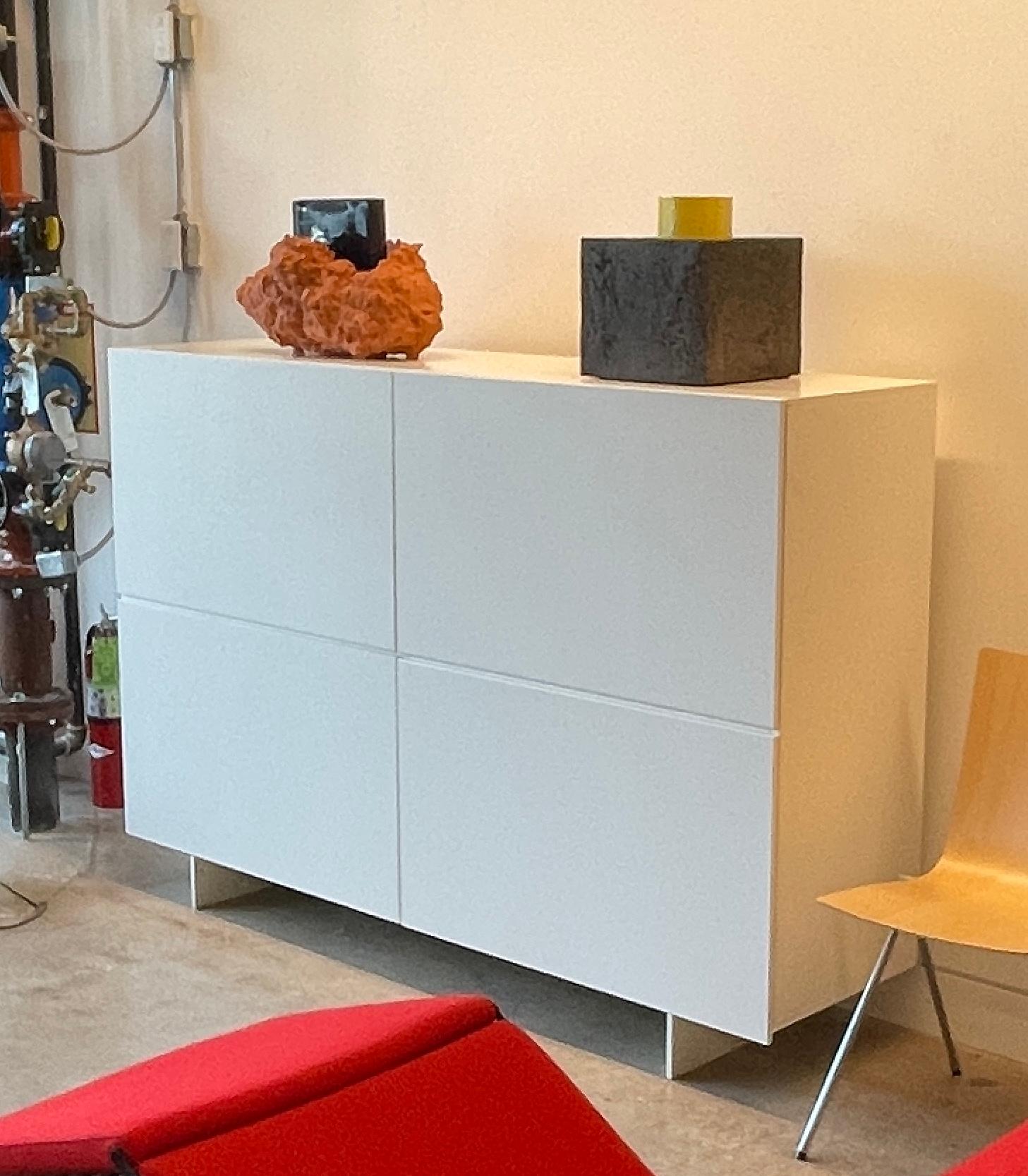 Uni UN_7Q four door cabinet in matte white designed by Piero Lissoni and manufactured by Cappellini, Italy circa 2010.

The elegant Uni cabinet designed by Piero Lissoni is crafted from high-density conglomerate wood. Thoughtfully equipped with