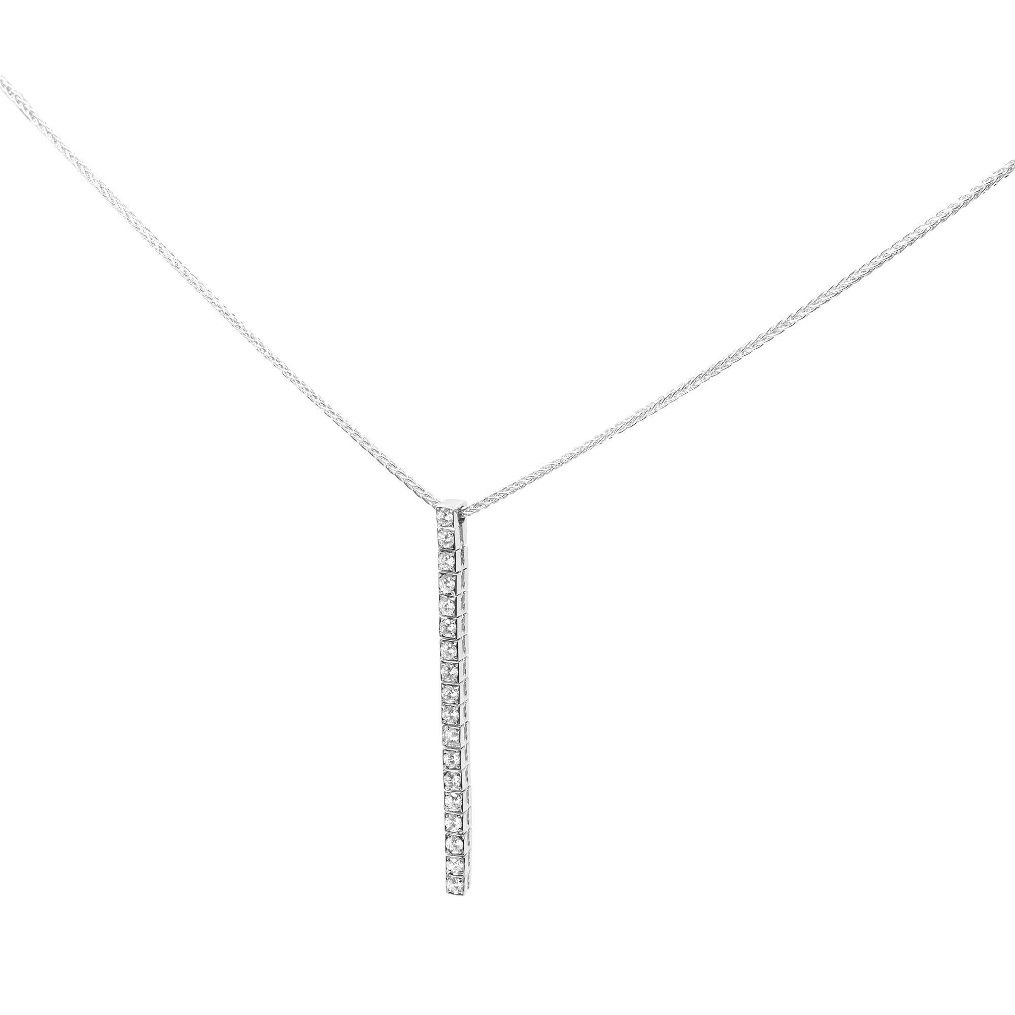 This is a Piero Milano 1 row natural diamond drop pendant necklace in 18K white gold. This elegant piece of jewelry is 16 inches long. Pendant size: 1.75 inches. Weights is 5.1 grams. Pendant is set with a total of 0.40cts. Diamond color G-H and