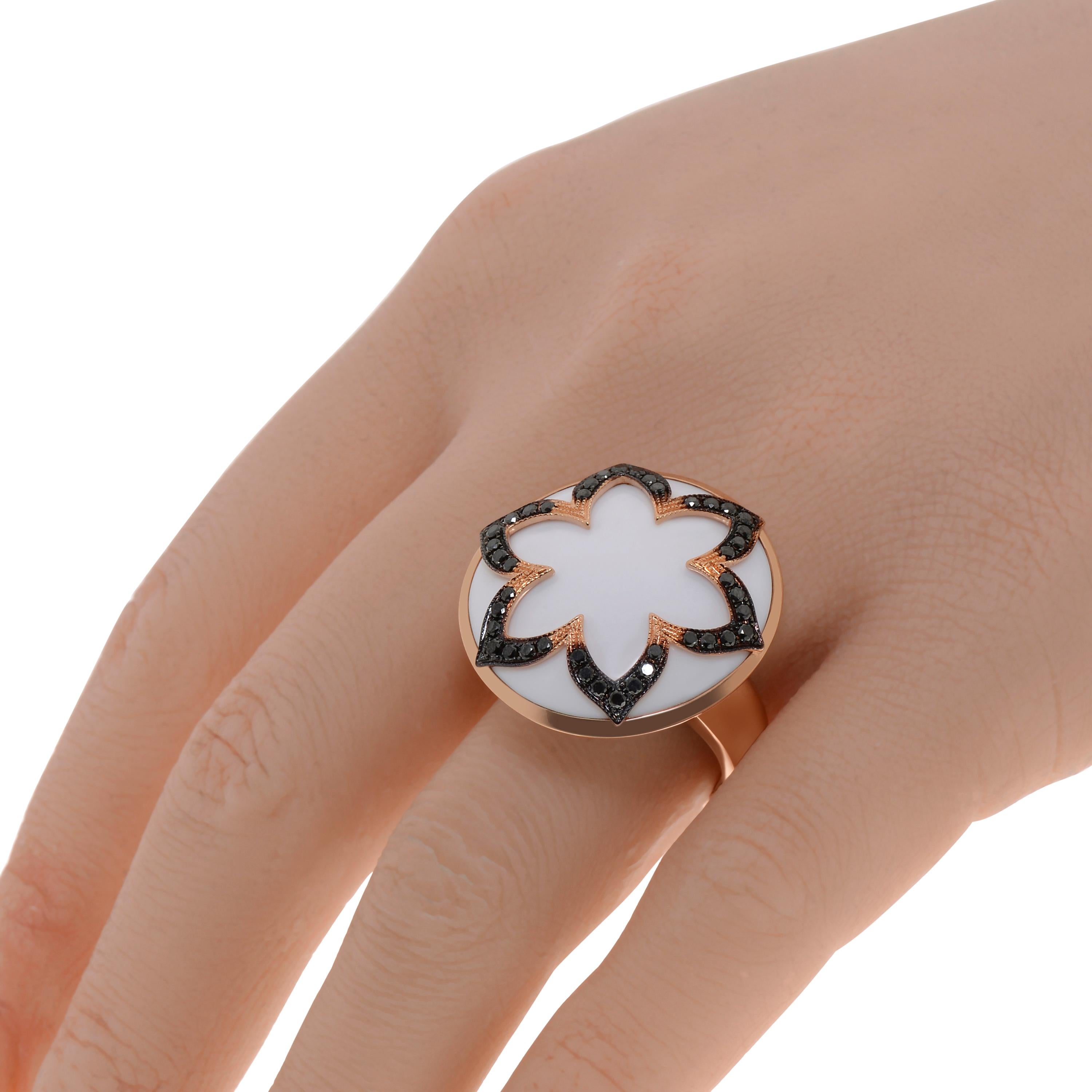 This brilliant Piero Milano 18K Rose Gold Cocktail Ring features an elegant black diamond flower 0.54ct. tw. set above a milky White Agate (33ct) set in Rose Gold. The ring size is 7.75 (56.3). The Decoration Size is 26.0mm. The Weight is