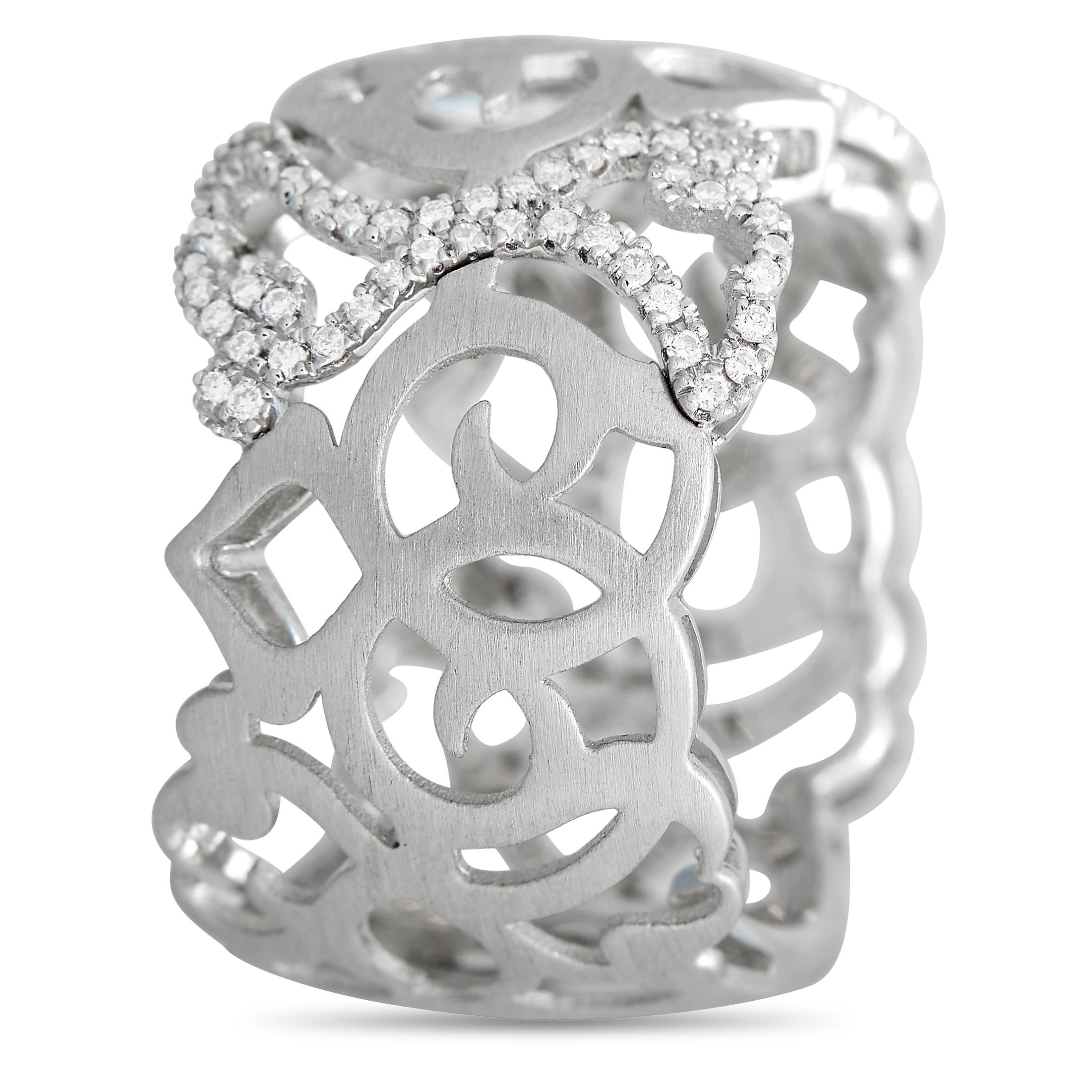 Intricate metalwork makes this Piero Milano ring a show-stopping piece with a distinctly artistic point of view. Crafted from 18K White Gold, it measures 11mm wide and features unique cut-out accents. Inset diamonds totaling 0.38 carats provide the
