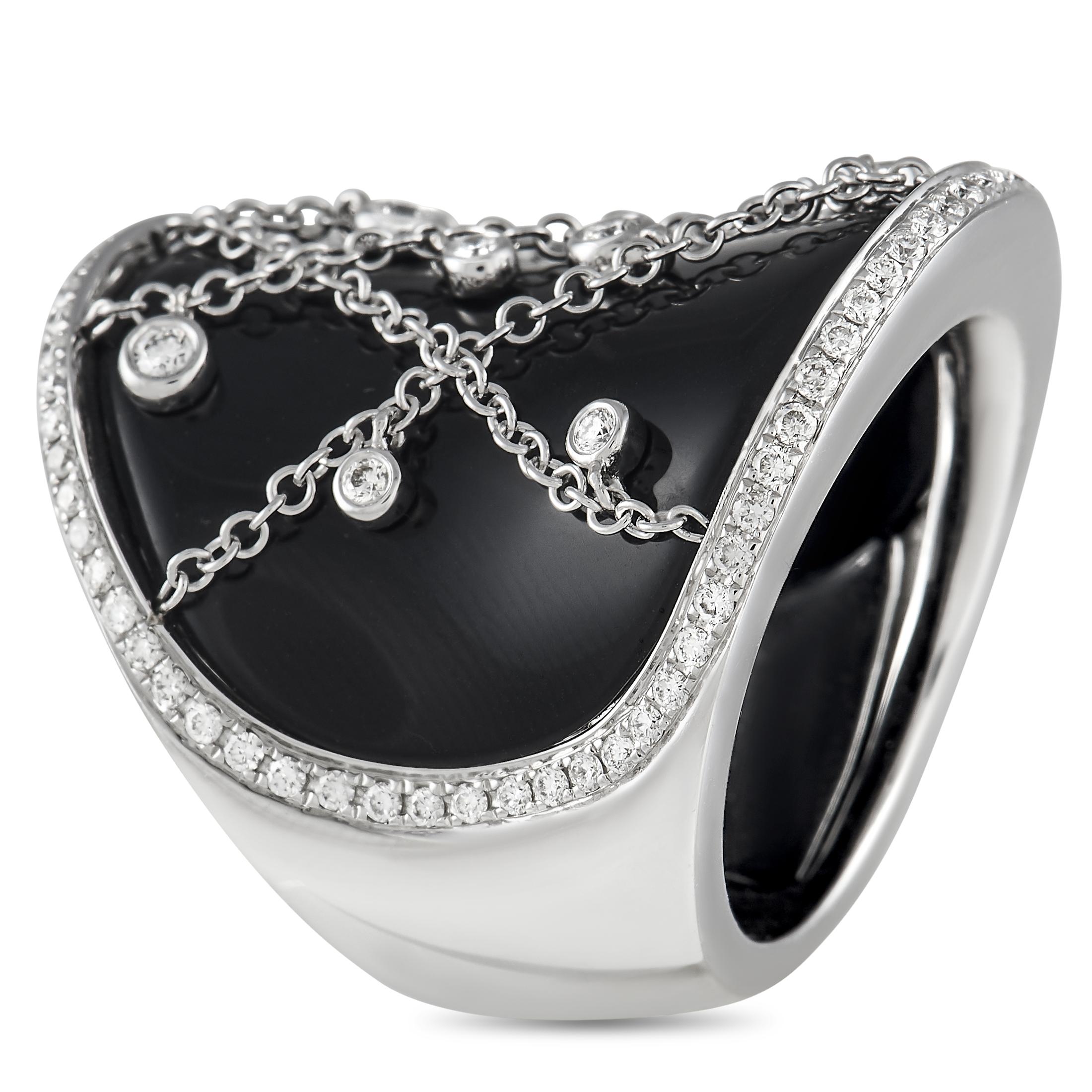 Definitely a statement-making ring. This Piero Milano piece is a little work of art suitable for any hand. It features a concave band that tapers towards the end. The wide front center has a black surface and is the perfect background for a stylized