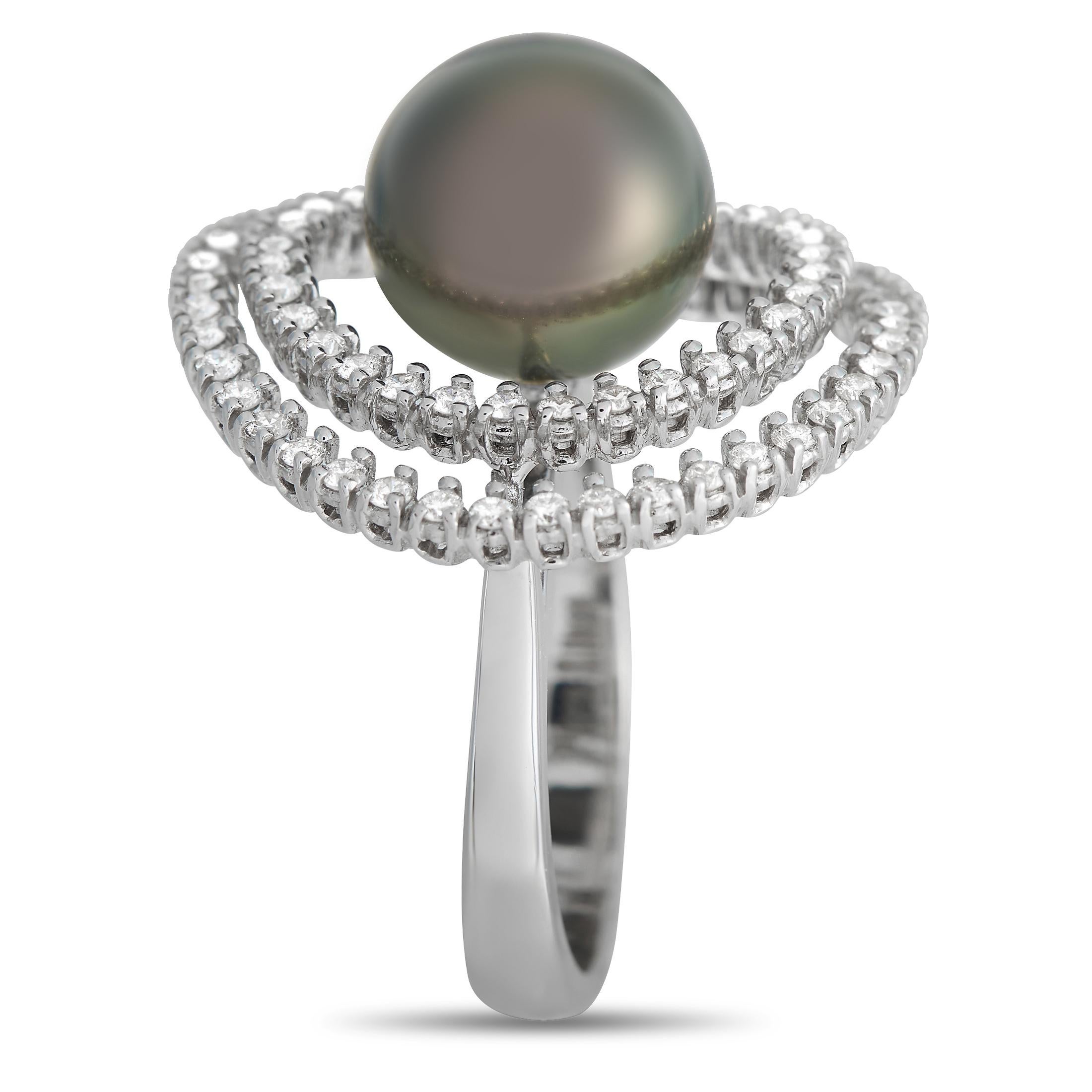 This Piero Milano ring is bold, eye-catching, and delightfully unexpected. On this dynamic design, a double halo of diamonds totaling 0.98 carats encircle a single black pearl suspended in the center of the 18K White Gold setting. This creative