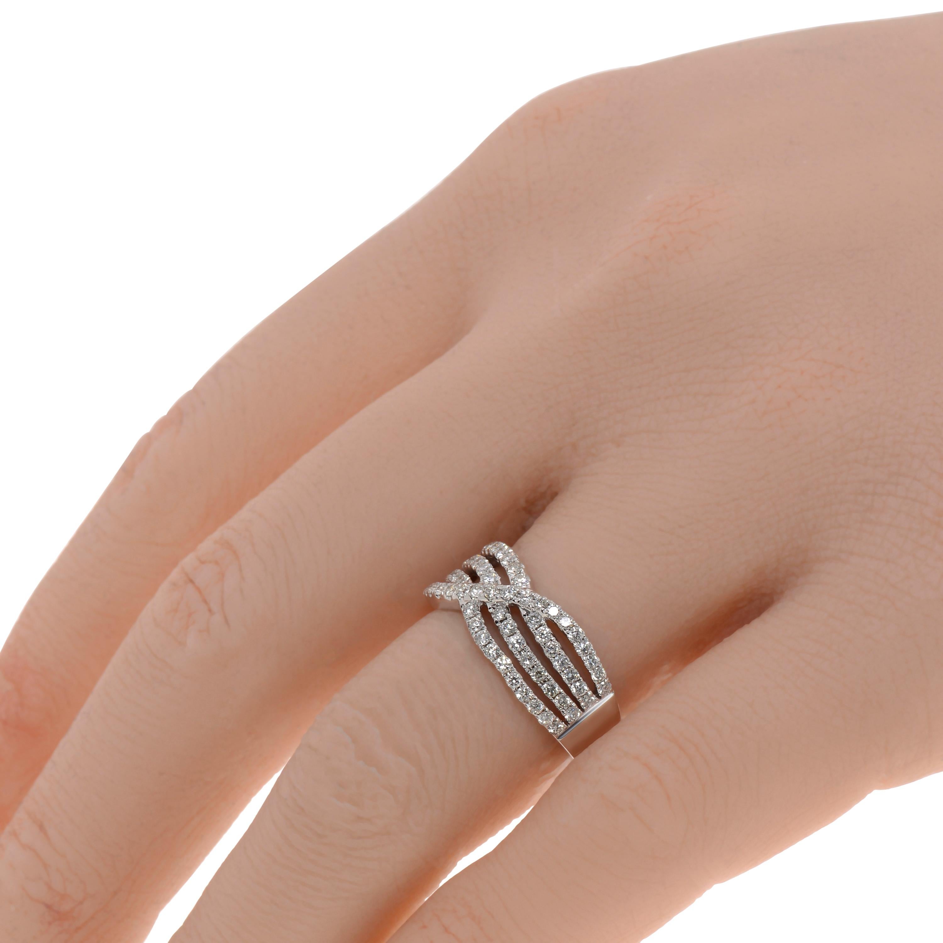 This graceful Piero Milano 18K White Gold Highway Ring features a waved diamond strand overlapping three glittering layers of diamond pave 0.71ct. tw. The ring size is 5.75 (51.2). The Band Width is 7.7mm. The Weight is 5.9g.
