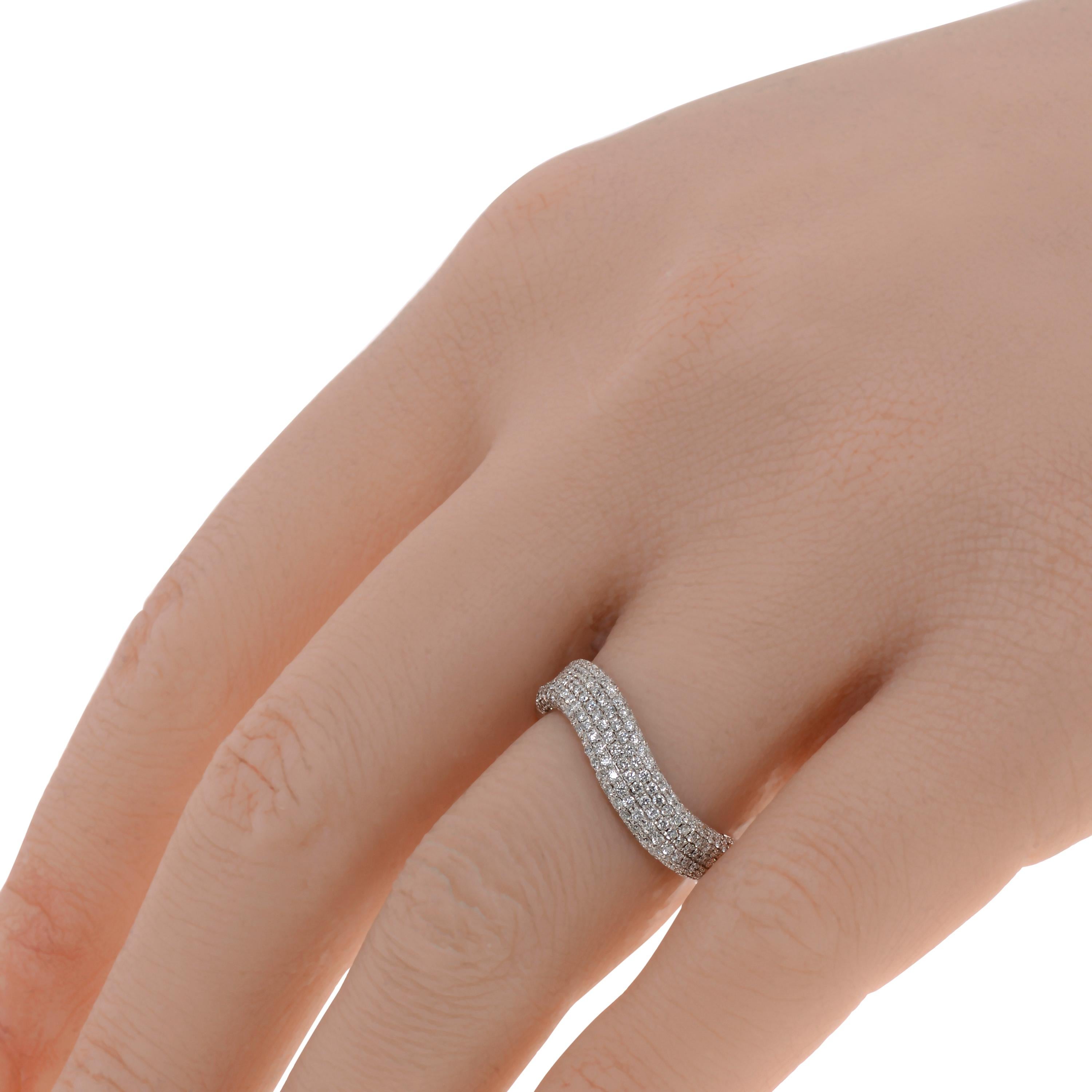 This contemporary Piero Milano 18K White Gold Curved Ring features layers of striking diamonds 0.65ct. tw. lining a curved white gold band. The ring size is 6.25 (52.5). The Band Width is 4.5mm. The Weight is 4.1g. Diamond Color: G-H. Diamond