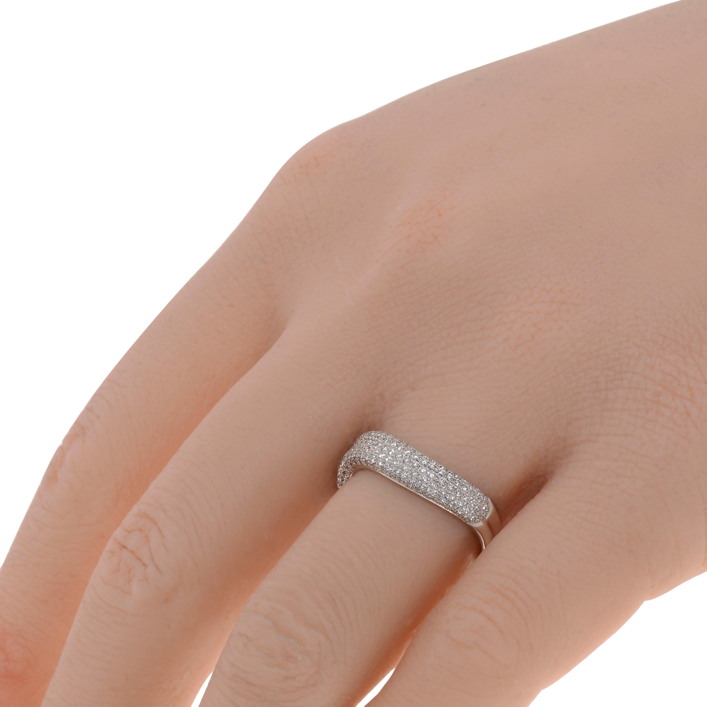 This contemporary Piero Milano 18K White Gold Curved Ring features layers of striking diamonds 0.6ct. tw. lining a curved white gold band. The ring size is 6.5 (53.1). The Band Width is 4.5mm. The Weight is 4.2g. Diamond Color: G-H. Diamond Clarity: